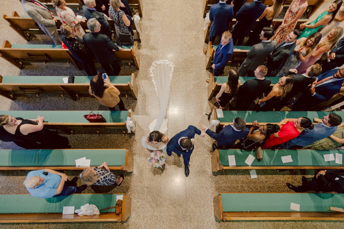 Jackie and Nick the two New Yorkers wanted to get away from busy packed streets of NY and get married in NJ, The Rockleigh NJ. Jackie got ready at her parents house in Hasbrouck Heights in NJ where her mom and bridesmaids showered her with love while they got ready together for her wedding. Nick also got ready at his parents house in Park Ridge NJ. Jackie & Nick got into their limos and drove to the chapel Our Lady of mercy Church in Park Ridge NJ for their wedding ceremony. Jackie and Nick's beautiful wedding ceremony was over at Our Lady of Mercy Church followed by family photos at the church before heading over to The Rockleigh for their wedding reception and to party! The Rockleigh's garden's were beautiful with flowers and perfectly manicured bushes, trees and flowers. I did all of Jackie and Nick's wedding photos at the garden at The Rockleigh including extended family photos, bridal party photos as well as newly weds couple's photos. Then Jackie and Nick joined their guests at their cocktail hour to start their wedding party. Fun and beautiful wedding reception continued till midnight at The Rockleigh. Jackie and Nick's The Rockleigh NJ Wedding documented by by Karis | Hey Karis | Catskills, Hudson Valley NY elopement and wedding photographer | Brooklyn NY elopement and wedding photographer | Manhattan NY elopement and wedding photographer | Hey Karis is fun documentary wedding and elopement photographer.
