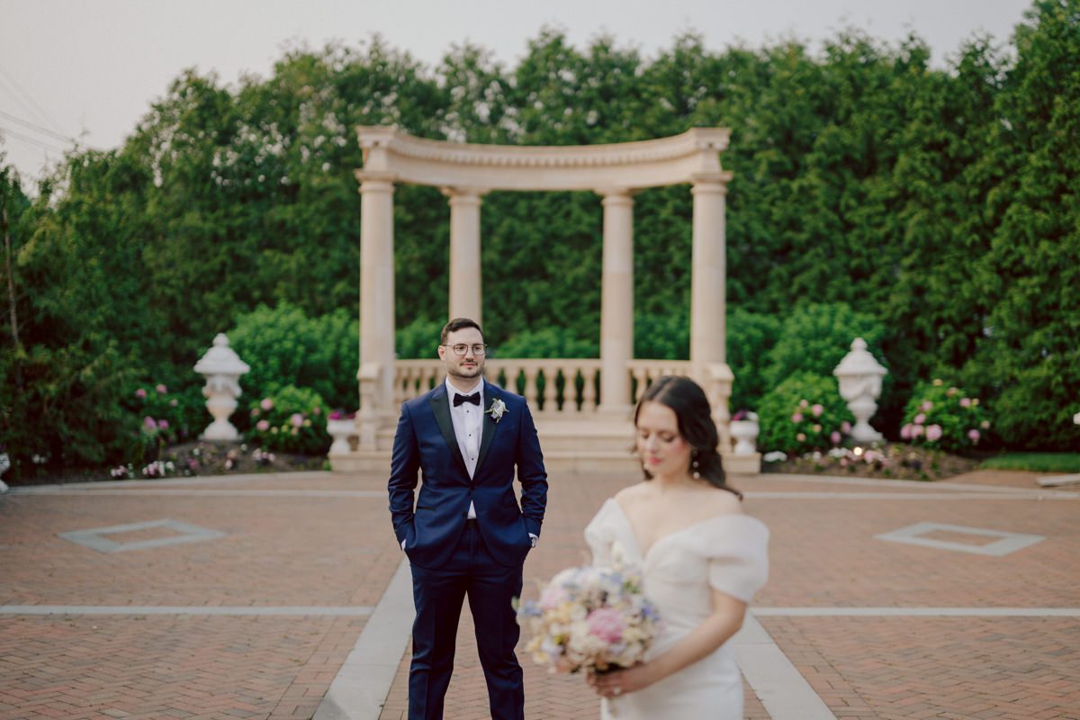 Jackie and Nick the two New Yorkers wanted to get away from busy packed streets of NY and get married in NJ, The Rockleigh NJ. Jackie got ready at her parents house in Hasbrouck Heights in NJ where her mom and bridesmaids showered her with love while they got ready together for her wedding. Nick also got ready at his parents house in Park Ridge NJ. Jackie & Nick got into their limos and drove to the chapel Our Lady of mercy Church in Park Ridge NJ for their wedding ceremony. Jackie and Nick's beautiful wedding ceremony was over at Our Lady of Mercy Church followed by family photos at the church before heading over to The Rockleigh for their wedding reception and to party! The Rockleigh's garden's were beautiful with flowers and perfectly manicured bushes, trees and flowers. I did all of Jackie and Nick's wedding photos at the garden at The Rockleigh including extended family photos, bridal party photos as well as newly weds couple's photos. Then Jackie and Nick joined their guests at their cocktail hour to start their wedding party. Fun and beautiful wedding reception continued till midnight at The Rockleigh. Jackie and Nick's The Rockleigh NJ Wedding documented by by Karis | Hey Karis | Catskills, Hudson Valley NY elopement and wedding photographer | Brooklyn NY elopement and wedding photographer | Manhattan NY elopement and wedding photographer | Hey Karis is fun documentary wedding and elopement photographer.