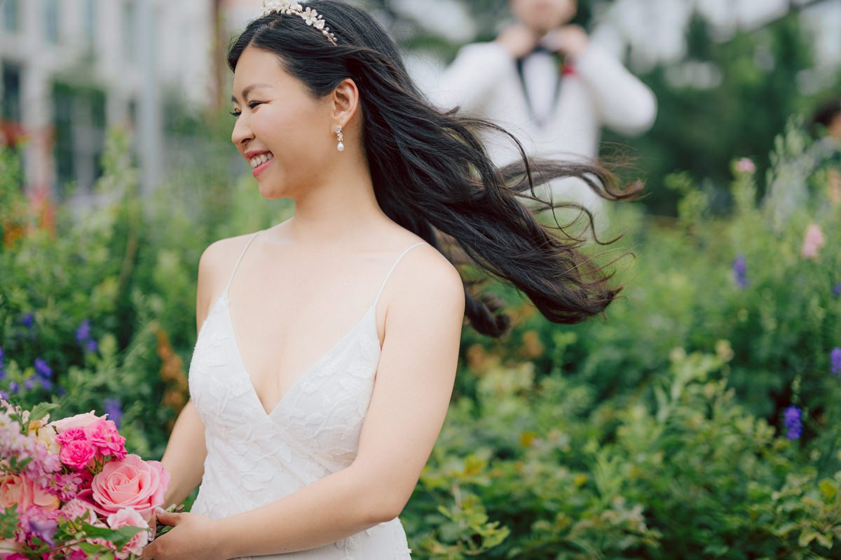 It's with immense joy that I share the unforgettable moments from Katherine and Omar's enchanting wedding day at The W Loft in Brooklyn, New York. Katherine and Omar saw each other for the first time rooftop of The W Loft with stunning backdrop of the city's skyline. The two spend some time talking and admiring each other during their first look, then as the moment finished and Katherine and Omar gave me the cue that they are ready to go to Domino Park (Williamsburg Bridge and the East River at the backdrop) was only around the corner from The W Loft for their wedding photos. We walked together with Katherine and Omar's bridal party to Domino Park, it was a typical hot NY summer on their wedding day and doing photos outside in the heat wasn't easy especially with so many people/crowd at Domino Park but we managed and even grabbed ice cream on the way back to The W Loft. Rooftop was busy setting up for Katherine and Omar's wedding ceremony with few guests already filing in the seats. Katherine and Omar's breathtaking wedding ceremony on The W Loft rooftop with Williamsburg Bridge to the side, the East River with city scape was a perfect backdrop for these New Yorkers to say their I do's. Then Katherine and Omar listened to sweet talks offered by their friends and family enjoyed their wedding reception. Katherine and Omar's The W Loft Brooklyn NY wedding documented by by Karis | Hey Karis | Catskills, Hudson Valley NY elopement and wedding photographer | Brooklyn NY elopement and wedding photographer | Manhattan NY elopement and wedding photographer | Hey Karis is fun documentary wedding and elopement photographer.