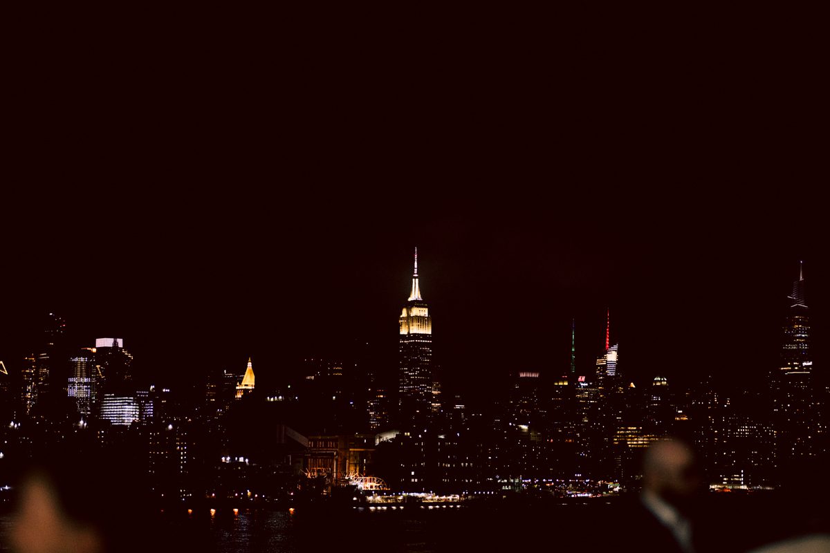 It's with immense joy that I share the unforgettable moments from Katherine and Omar's enchanting wedding day at The W Loft in Brooklyn, New York. Katherine and Omar saw each other for the first time rooftop of The W Loft with stunning backdrop of the city's skyline. The two spend some time talking and admiring each other during their first look, then as the moment finished and Katherine and Omar gave me the cue that they are ready to go to Domino Park (Williamsburg Bridge and the East River at the backdrop) was only around the corner from The W Loft for their wedding photos. We walked together with Katherine and Omar's bridal party to Domino Park, it was a typical hot NY summer on their wedding day and doing photos outside in the heat wasn't easy especially with so many people/crowd at Domino Park but we managed and even grabbed ice cream on the way back to The W Loft. Rooftop was busy setting up for Katherine and Omar's wedding ceremony with few guests already filing in the seats. Katherine and Omar's breathtaking wedding ceremony on The W Loft rooftop with Williamsburg Bridge to the side, the East River with city scape was a perfect backdrop for these New Yorkers to say their I do's. Then Katherine and Omar listened to sweet talks offered by their friends and family enjoyed their wedding reception. Katherine and Omar's The W Loft Brooklyn NY wedding documented by by Karis | Hey Karis | Catskills, Hudson Valley NY elopement and wedding photographer | Brooklyn NY elopement and wedding photographer | Manhattan NY elopement and wedding photographer | Hey Karis is fun documentary wedding and elopement photographer.