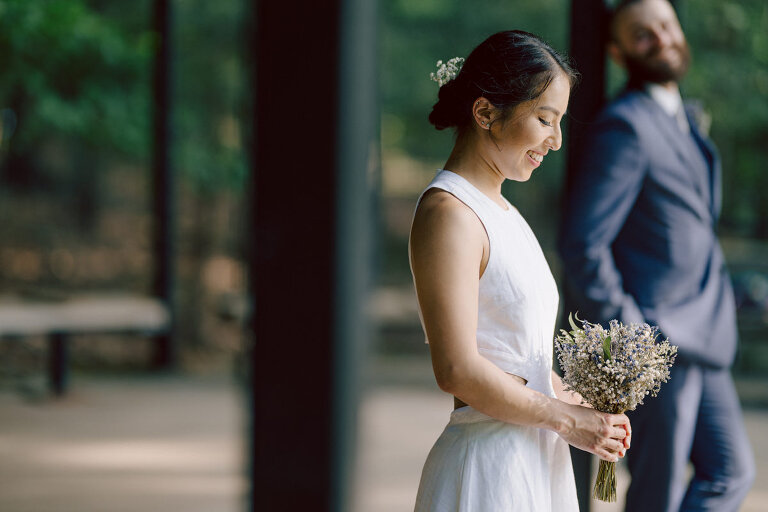 Ari and Kevin are big nature lovers, and they love the outdoors. For their intimate elopement they chose James A McFaul Environmental Center for their intimate wedding ceremony joined by their immediate family. Total of 10 people standing around Ari and Kevin surrounded by nature Ari & Kevin's sweetest wedding ceremony was held. Ari and Kevin looked at each other with the sweetest smiles it almost melted us. After the sweetest wedding ceremony at James A McFaul Environmental Center I took some wedding photos of Ari and Kevin then we left for Ari and Kevin's small and intimate dinner with family at Jockey Hollow Bar & Kitchen Morristown NJ. Morristown is such a beautiful town, and in front of Jockey Hollow Bar & Kitchen is such a picturesque backdrop with long water fountain, trees and flowers. So before Ari and Kevin sat down for their intimate dinner with family we walked around Morristown for quick photos. Then all 10 of them sat down in a private room at Jockey Hollow Bar & Kitchen to celebrate Ari and Kevin's union. Air and Kevin's James A McFaul Environmental Center and Jockey Hollow Bar & Kitchen Morristown NJ Elopement documented by by Karis | Hey Karis | Catskills, Hudson Valley NY elopement and wedding photographer | Brooklyn NY elopement and wedding photographer | Manhattan NY elopement and wedding photographer | Hey Karis is fun documentary wedding and elopement photographer.