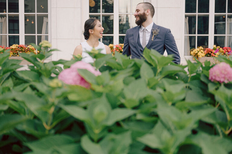 Ari and Kevin are big nature lovers, and they love the outdoors. For their intimate elopement they chose James A McFaul Environmental Center for their intimate wedding ceremony joined by their immediate family. Total of 10 people standing around Ari and Kevin surrounded by nature Ari & Kevin's sweetest wedding ceremony was held. Ari and Kevin looked at each other with the sweetest smiles it almost melted us. After the sweetest wedding ceremony at James A McFaul Environmental Center I took some wedding photos of Ari and Kevin then we left for Ari and Kevin's small and intimate dinner with family at Jockey Hollow Bar & Kitchen Morristown NJ. Morristown is such a beautiful town, and in front of Jockey Hollow Bar & Kitchen is such a picturesque backdrop with long water fountain, trees and flowers. So before Ari and Kevin sat down for their intimate dinner with family we walked around Morristown for quick photos. Then all 10 of them sat down in a private room at Jockey Hollow Bar & Kitchen to celebrate Ari and Kevin's union. Air and Kevin's James A McFaul Environmental Center and Jockey Hollow Bar & Kitchen Morristown NJ Elopement documented by by Karis | Hey Karis | Catskills, Hudson Valley NY elopement and wedding photographer | Brooklyn NY elopement and wedding photographer | Manhattan NY elopement and wedding photographer | Hey Karis is fun documentary wedding and elopement photographer.