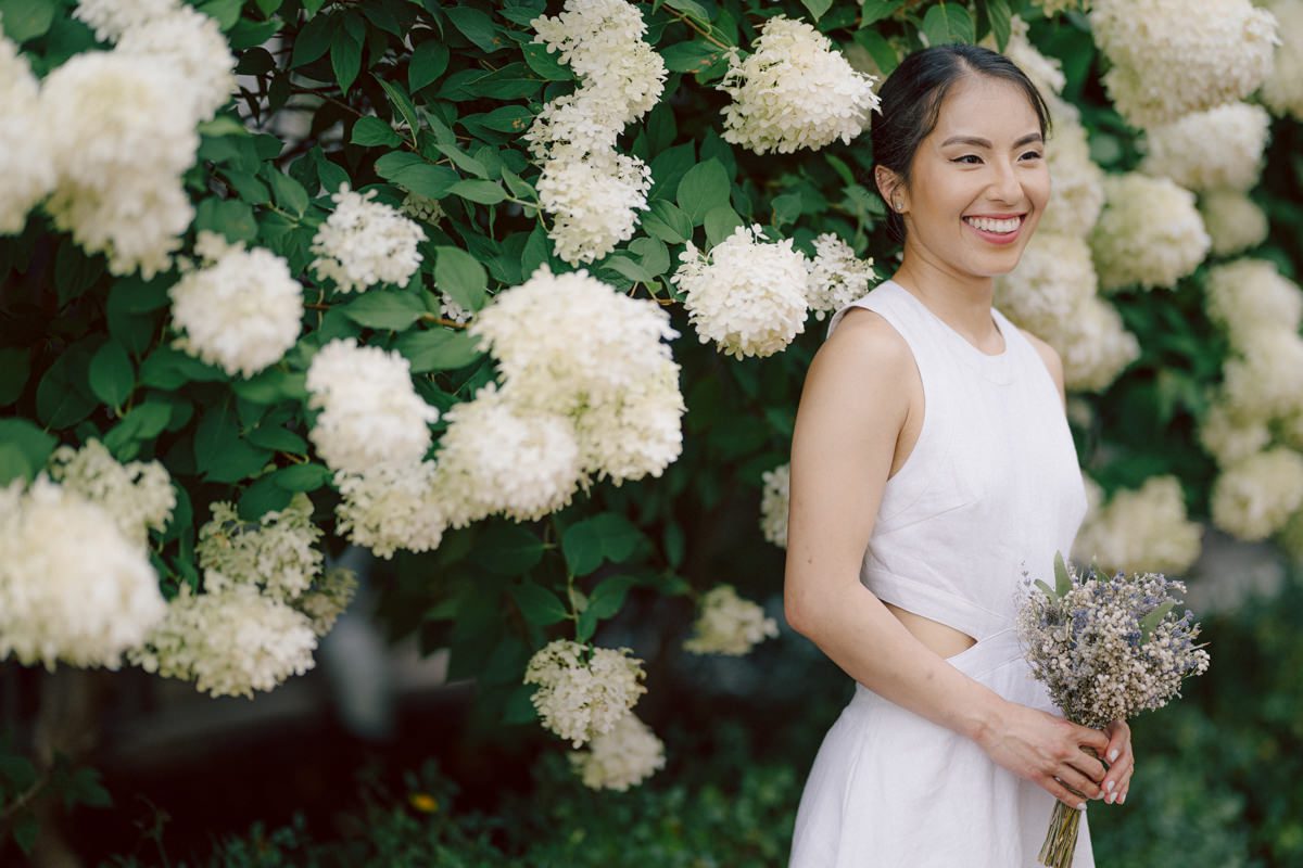 Ari and Kevin are big nature lovers, and they love the outdoors. For their intimate elopement they chose James A McFaul Environmental Center for their intimate wedding ceremony joined by their immediate family. Total of 10 people standing around Ari and Kevin surrounded by nature Ari & Kevin's sweetest wedding ceremony was held. Ari and Kevin looked at each other with the sweetest smiles it almost melted us. After the sweetest wedding ceremony at James A McFaul Environmental Center I took some wedding photos of Ari and Kevin then we left for Ari and Kevin's small and intimate dinner with family at Jockey Hollow Bar & Kitchen Morristown NJ. Morristown is such a beautiful town, and in front of Jockey Hollow Bar & Kitchen is such a picturesque backdrop with long water fountain, trees and flowers. So before Ari and Kevin sat down for their intimate dinner with family we walked around Morristown for quick photos. Then all 10 of them sat down in a private room at Jockey Hollow Bar & Kitchen to celebrate Ari and Kevin's union. Air and Kevin's James A McFaul Environmental Center and Jockey Hollow Bar & Kitchen Morristown NJ Elopement documented by by Karis | Hey Karis | Catskills, Hudson Valley NY elopement and wedding photographer | Brooklyn NY elopement and wedding photographer | Manhattan NY elopement and wedding photographer | Hey Karis is fun documentary wedding and elopement photographer.
