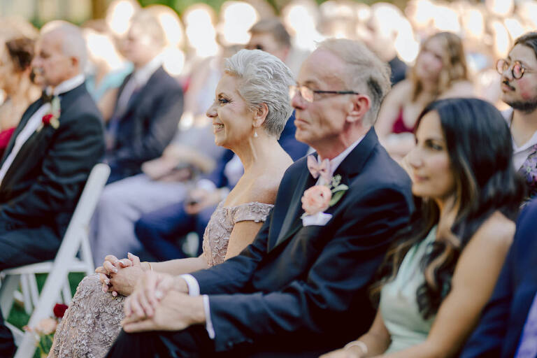 How do I explain the sincere and true feelings that Izzy and Brendan shared on their wedding day at one of the most magical place Arrow Park in Monroe NY. Izzy is Opera singer and Brendan is a Chef who owns his own restaurant called Circle in Newton, NJ got married at Arrow Park NY a month ago and it got real festive and wild real fast. But let's come back to the wild party in a bit and talk about their morning first. Izzy and Brendan both got ready onsite at Arrow Park, great thing about Arrow Park is that it has enough rooms to host all their bridal party and family. With all of Izzy and Brendan's loved ones onsite Izzy and Brendan's wedding prep was fun. No drama and no one running late, Izzy and Brendan's wedding prep went so smooth with everyone's cooperation! Izzy got into her dress with her mom and sister by her side, then we went down to the back steps for Izzy and Brendan's first look. Oh boy Brendan got super emotional for their first look, he couldn't even turn around to look at Izzy with all the happy emotions rushing to him. Izzy held his hand and they looked at each other. The two of them cried. Sharing such a beautiful first look Izzy and Brendan walked out to the front of Arrow Park for group and family photos. It was an August wedding so I kept everyone in the shade not too far, making it simple easy for group and family photos are important job to wedding photographer. After all the formal group photos were done, it was almost time for their wedding ceremony at the garden. Beautiful decor and floral arrangements were set up in the garden ready for Izzy and Brendan's wedding ceremony, guest started to walked down the long driveway and down the steps and found seats waited for the bride and groom to walk down the aisle. Brendan now standing in the front next to the priest, started tearing up as soon as he saw Izzy coming down the aisle escorted by her father. The two linked their eyes at each other and in the most loving way possible looked at each other through out the ceremony then sealed it with the first kiss as husband and wife. As calm and peaceful as Izzy and Brendan's wedding ceremony was, the two entered their reception each with (shaken) champagne bottles in their hands, everyone and anyone in Izzy and Brendan's way got sprayed with Champagne! They jumped, pouring Champagne into their friends mouth straight out of the bottle, then each drank some out of the bottle. Building the excitement in to their epic wedding party, Izzy and Brendan held each others hands and walked into the center of Arrow Park's courtyard and danced their first dance. Smoke and smell of freshly cooked dinner being prepared by Brendan's friends at Promises Kept Hudson Valley NY was filling the air, as first courses were being served. Happiest sound of plates, utensils and people chatting, Izzy and Brendan sat at their sweetheart table to enjoy their wedding dinner prepared by Promises Kept Hudson Valley NY. Then the evening got deeper and darker and vibe got stronger and crazier. Music got louder and everyone was in their element celebrating Izzy and Brendan on their wedding day. Izzy and Brendan's Arrow Park Monroe NY Wedding documented by by Karis | Hey Karis | Catskills, Hudson Valley NY elopement and wedding photographer | Brooklyn NY elopement and wedding photographer | Manhattan NY elopement and wedding photographer | Hey Karis is fun documentary wedding and elopement photographer.