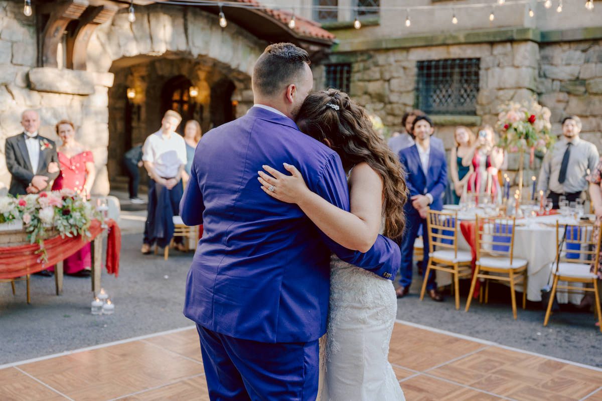 How do I explain the sincere and true feelings that Izzy and Brendan shared on their wedding day at one of the most magical place Arrow Park in Monroe NY. Izzy is Opera singer and Brendan is a Chef who owns his own restaurant called Circle in Newton, NJ got married at Arrow Park NY a month ago and it got real festive and wild real fast. But let's come back to the wild party in a bit and talk about their morning first. Izzy and Brendan both got ready onsite at Arrow Park, great thing about Arrow Park is that it has enough rooms to host all their bridal party and family. With all of Izzy and Brendan's loved ones onsite Izzy and Brendan's wedding prep was fun. No drama and no one running late, Izzy and Brendan's wedding prep went so smooth with everyone's cooperation! Izzy got into her dress with her mom and sister by her side, then we went down to the back steps for Izzy and Brendan's first look. Oh boy Brendan got super emotional for their first look, he couldn't even turn around to look at Izzy with all the happy emotions rushing to him. Izzy held his hand and they looked at each other. The two of them cried. Sharing such a beautiful first look Izzy and Brendan walked out to the front of Arrow Park for group and family photos. It was an August wedding so I kept everyone in the shade not too far, making it simple easy for group and family photos are important job to wedding photographer. After all the formal group photos were done, it was almost time for their wedding ceremony at the garden. Beautiful decor and floral arrangements were set up in the garden ready for Izzy and Brendan's wedding ceremony, guest started to walked down the long driveway and down the steps and found seats waited for the bride and groom to walk down the aisle. Brendan now standing in the front next to the priest, started tearing up as soon as he saw Izzy coming down the aisle escorted by her father. The two linked their eyes at each other and in the most loving way possible looked at each other through out the ceremony then sealed it with the first kiss as husband and wife. As calm and peaceful as Izzy and Brendan's wedding ceremony was, the two entered their reception each with (shaken) champagne bottles in their hands, everyone and anyone in Izzy and Brendan's way got sprayed with Champagne! They jumped, pouring Champagne into their friends mouth straight out of the bottle, then each drank some out of the bottle. Building the excitement in to their epic wedding party, Izzy and Brendan held each others hands and walked into the center of Arrow Park's courtyard and danced their first dance. Smoke and smell of freshly cooked dinner being prepared by Brendan's friends at Promises Kept Hudson Valley NY was filling the air, as first courses were being served. Happiest sound of plates, utensils and people chatting, Izzy and Brendan sat at their sweetheart table to enjoy their wedding dinner prepared by Promises Kept Hudson Valley NY. Then the evening got deeper and darker and vibe got stronger and crazier. Music got louder and everyone was in their element celebrating Izzy and Brendan on their wedding day. Izzy and Brendan's Arrow Park Monroe NY Wedding documented by by Karis | Hey Karis | Catskills, Hudson Valley NY elopement and wedding photographer | Brooklyn NY elopement and wedding photographer | Manhattan NY elopement and wedding photographer | Hey Karis is fun documentary wedding and elopement photographer.