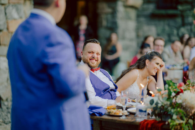 How do I explain the sincere and true feelings that Izzy and Brendan shared on their wedding day at one of the most magical place Arrow Park in Monroe NY. Izzy is Opera singer and Brendan is a Chef who owns his own restaurant called Circle in Newton, NJ got married at Arrow Park NY a month ago and it got real festive and wild real fast. But let's come back to the wild party in a bit and talk about their morning first. Izzy and Brendan both got ready onsite at Arrow Park, great thing about Arrow Park is that it has enough rooms to host all their bridal party and family. With all of Izzy and Brendan's loved ones onsite Izzy and Brendan's wedding prep was fun. No drama and no one running late, Izzy and Brendan's wedding prep went so smooth with everyone's cooperation! Izzy got into her dress with her mom and sister by her side, then we went down to the back steps for Izzy and Brendan's first look. Oh boy Brendan got super emotional for their first look, he couldn't even turn around to look at Izzy with all the happy emotions rushing to him. Izzy held his hand and they looked at each other. The two of them cried. Sharing such a beautiful first look Izzy and Brendan walked out to the front of Arrow Park for group and family photos. It was an August wedding so I kept everyone in the shade not too far, making it simple easy for group and family photos are important job to wedding photographer. After all the formal group photos were done, it was almost time for their wedding ceremony at the garden. Beautiful decor and floral arrangements were set up in the garden ready for Izzy and Brendan's wedding ceremony, guest started to walked down the long driveway and down the steps and found seats waited for the bride and groom to walk down the aisle. Brendan now standing in the front next to the priest, started tearing up as soon as he saw Izzy coming down the aisle escorted by her father. The two linked their eyes at each other and in the most loving way possible looked at each other through out the ceremony then sealed it with the first kiss as husband and wife. As calm and peaceful as Izzy and Brendan's wedding ceremony was, the two entered their reception each with (shaken) champagne bottles in their hands, everyone and anyone in Izzy and Brendan's way got sprayed with Champagne! They jumped, pouring Champagne into their friends mouth straight out of the bottle, then each drank some out of the bottle. Building the excitement in to their epic wedding party, Izzy and Brendan held each others hands and walked into the center of Arrow Park's courtyard and danced their first dance. Smoke and smell of freshly cooked dinner being prepared by Brendan's friends at Promises Kept Hudson Valley NY was filling the air, as first courses were being served. Happiest sound of plates, utensils and people chatting, Izzy and Brendan sat at their sweetheart table to enjoy their wedding dinner prepared by Promises Kept Hudson Valley NY. Then the evening got deeper and darker and vibe got stronger and crazier. Music got louder and everyone was in their element celebrating Izzy and Brendan on their wedding day. Izzy and Brendan's Arrow Park Monroe NY Wedding documented by by Karis | Hey Karis | Catskills, Hudson Valley NY elopement and wedding photographer | Brooklyn NY elopement and wedding photographer | Manhattan NY elopement and wedding photographer | Hey Karis is fun documentary wedding and elopement photographer.