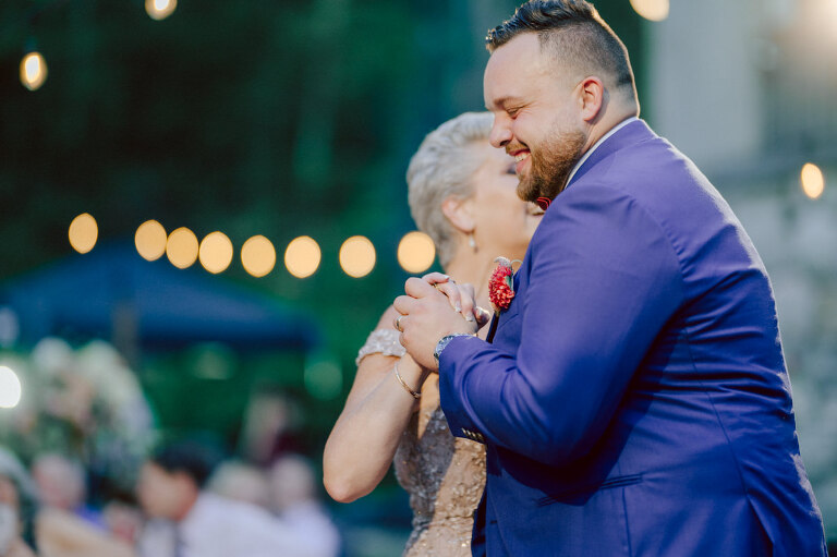 How do I explain the sincere and true feelings that Izzy and Brendan shared on their wedding day at one of the most magical place Arrow Park in Monroe NY. Izzy is Opera singer and Brendan is a Chef who owns his own restaurant called Circle in Newton, NJ got married at Arrow Park NY a month ago and it got real festive and wild real fast. But let's come back to the wild party in a bit and talk about their morning first. Izzy and Brendan both got ready onsite at Arrow Park, great thing about Arrow Park is that it has enough rooms to host all their bridal party and family. With all of Izzy and Brendan's loved ones onsite Izzy and Brendan's wedding prep was fun. No drama and no one running late, Izzy and Brendan's wedding prep went so smooth with everyone's cooperation! Izzy got into her dress with her mom and sister by her side, then we went down to the back steps for Izzy and Brendan's first look. Oh boy Brendan got super emotional for their first look, he couldn't even turn around to look at Izzy with all the happy emotions rushing to him. Izzy held his hand and they looked at each other. The two of them cried. Sharing such a beautiful first look Izzy and Brendan walked out to the front of Arrow Park for group and family photos. It was an August wedding so I kept everyone in the shade not too far, making it simple easy for group and family photos are important job to wedding photographer. After all the formal group photos were done, it was almost time for their wedding ceremony at the garden. Beautiful decor and floral arrangements were set up in the garden ready for Izzy and Brendan's wedding ceremony, guest started to walked down the long driveway and down the steps and found seats waited for the bride and groom to walk down the aisle. Brendan now standing in the front next to the priest, started tearing up as soon as he saw Izzy coming down the aisle escorted by her father. The two linked their eyes at each other and in the most loving way possible looked at each other through out the ceremony then sealed it with the first kiss as husband and wife. As calm and peaceful as Izzy and Brendan's wedding ceremony was, the two entered their reception each with (shaken) champagne bottles in their hands, everyone and anyone in Izzy and Brendan's way got sprayed with Champagne! They jumped, pouring Champagne into their friends mouth straight out of the bottle, then each drank some out of the bottle. Building the excitement in to their epic wedding party, Izzy and Brendan held each others hands and walked into the center of Arrow Park's courtyard and danced their first dance. Smoke and smell of freshly cooked dinner being prepared by Brendan's friends at Promises Kept Hudson Valley NY was filling the air, as first courses were being served. Happiest sound of plates, utensils and people chatting, Izzy and Brendan sat at their sweetheart table to enjoy their wedding dinner prepared by Promises Kept Hudson Valley NY. Then the evening got deeper and darker and vibe got stronger and crazier. Music got louder and everyone was in their element celebrating Izzy and Brendan on their wedding day. Izzy and Brendan's Arrow Park Monroe NY Wedding documented by by Karis | Hey Karis | Catskills, Hudson Valley NY elopement and wedding photographer | Brooklyn NY elopement and wedding photographer | Manhattan NY elopement and wedding photographer | Hey Karis is fun documentary wedding and elopement photographer.