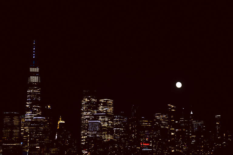 On September 1, 2023 Renee and Sam got married at Maritime Parc located in the center of Liberty State Park where you can get the best view of NYC skyline. Renee and Sam couldn't have asked for a better day, weather in October it was sunny, warm and gorgeous. Renee got ready at her parents' house in Paramus NJ where Renee intimately got ready for her wedding with her parents, two sisters and best friends. Renee's hair and makeup was done by Anna Posokhina from Bridal Squad. Once Renee was all glammed out by Anna Posokhina with help of her mother and two sisters walked into her Justin Alexander wedding dress. With final spray of Jo Malone perfume Renee walked out of her parents' house with her bridesmaids and stepped into her party bus. At the same time Sam was getting ready at Renee's sister's house in Hawthorne NJ with his family and groomsmen. Then Renee and Sam saw each other for the first time down the aisle at Our Lady of the Visitation in Paramus NJ. As soon as Sam saw Renee standing by the entrance of the church started crying. With plenty time for photo we arrived at Liberty State Park where Renee only wanted photos with NYC backdrop even it was staring at the bright sun and squinty eyes, i don't blame her because the view is spectacular and who wouldn't want photos with this gorgeous backdrop of NYC. Cocktail hour started and guests started fill the stairs to third floor of Maritime Parc. Renee and Sam's amazing wedding day at Maritime Parc continued with music provided by live band "The Hook Club" where they set the mood for all night of dancing. And we ended the evening with most amazing NYC skyline with Super moon rising above NYC. Renee and Sam's Maritime Park Jersey City NJ wedding photographed and documented by by Karis | Hey Karis | Catskills, Hudson Valley NY elopement and wedding photographer | Brooklyn NY elopement and wedding photographer | Manhattan NY elopement and wedding photographer | Hey Karis is fun documentary wedding and elopement photographer.