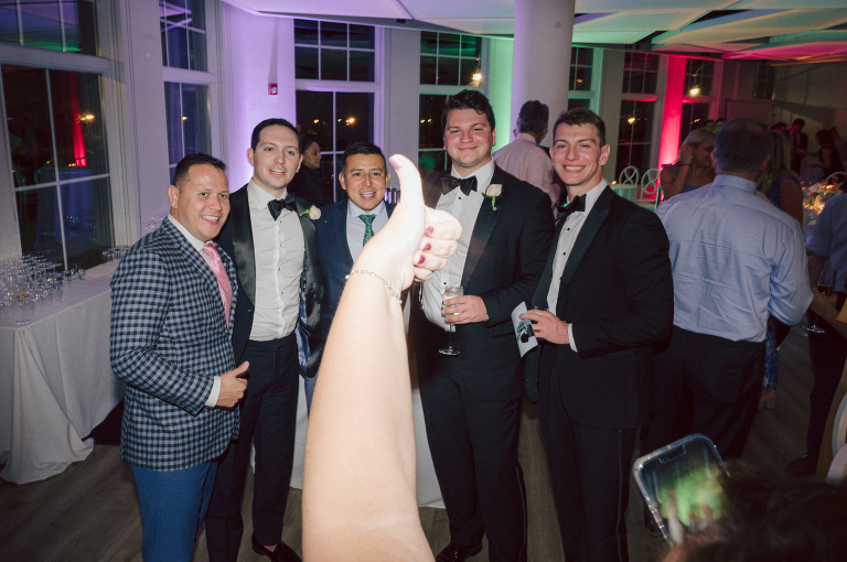 On September 1, 2023 Renee and Sam got married at Maritime Parc located in the center of Liberty State Park where you can get the best view of NYC skyline. Renee and Sam couldn't have asked for a better day, weather in October it was sunny, warm and gorgeous. Renee got ready at her parents' house in Paramus NJ where Renee intimately got ready for her wedding with her parents, two sisters and best friends. Renee's hair and makeup was done by Anna Posokhina from Bridal Squad. Once Renee was all glammed out by Anna Posokhina with help of her mother and two sisters walked into her Justin Alexander wedding dress. With final spray of Jo Malone perfume Renee walked out of her parents' house with her bridesmaids and stepped into her party bus. At the same time Sam was getting ready at Renee's sister's house in Hawthorne NJ with his family and groomsmen. Then Renee and Sam saw each other for the first time down the aisle at Our Lady of the Visitation in Paramus NJ. As soon as Sam saw Renee standing by the entrance of the church started crying. With plenty time for photo we arrived at Liberty State Park where Renee only wanted photos with NYC backdrop even it was staring at the bright sun and squinty eyes, i don't blame her because the view is spectacular and who wouldn't want photos with this gorgeous backdrop of NYC. Cocktail hour started and guests started fill the stairs to third floor of Maritime Parc. Renee and Sam's amazing wedding day at Maritime Parc continued with music provided by live band "The Hook Club" where they set the mood for all night of dancing. And we ended the evening with most amazing NYC skyline with Super moon rising above NYC. Renee and Sam's Maritime Park Jersey City NJ wedding photographed and documented by by Karis | Hey Karis | Catskills, Hudson Valley NY elopement and wedding photographer | Brooklyn NY elopement and wedding photographer | Manhattan NY elopement and wedding photographer | Hey Karis is fun documentary wedding and elopement photographer.