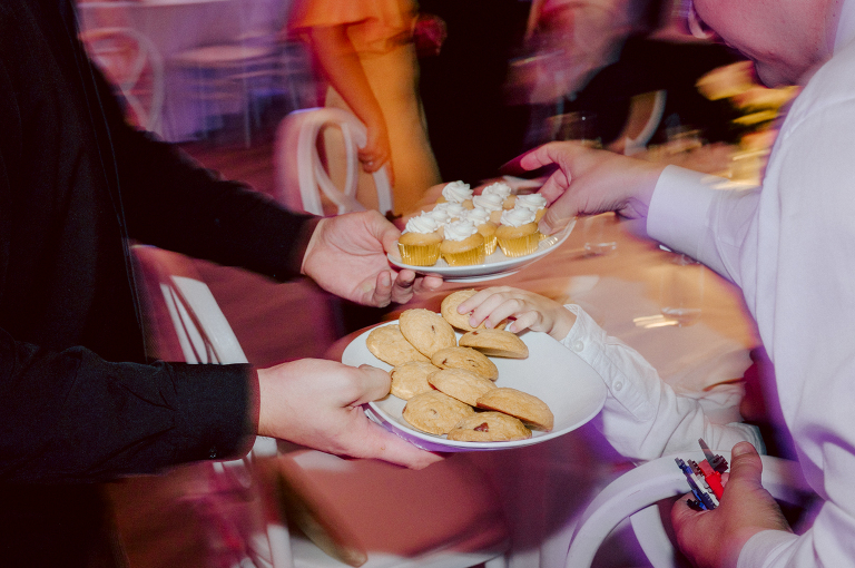 On September 1, 2023 Renee and Sam got married at Maritime Parc located in the center of Liberty State Park where you can get the best view of NYC skyline. Renee and Sam couldn't have asked for a better day, weather in October it was sunny, warm and gorgeous. Renee got ready at her parents' house in Paramus NJ where Renee intimately got ready for her wedding with her parents, two sisters and best friends. Renee's hair and makeup was done by Anna Posokhina from Bridal Squad. Once Renee was all glammed out by Anna Posokhina with help of her mother and two sisters walked into her Justin Alexander wedding dress. With final spray of Jo Malone perfume Renee walked out of her parents' house with her bridesmaids and stepped into her party bus. At the same time Sam was getting ready at Renee's sister's house in Hawthorne NJ with his family and groomsmen. Then Renee and Sam saw each other for the first time down the aisle at Our Lady of the Visitation in Paramus NJ. As soon as Sam saw Renee standing by the entrance of the church started crying. With plenty time for photo we arrived at Liberty State Park where Renee only wanted photos with NYC backdrop even it was staring at the bright sun and squinty eyes, i don't blame her because the view is spectacular and who wouldn't want photos with this gorgeous backdrop of NYC. Cocktail hour started and guests started fill the stairs to third floor of Maritime Parc. Renee and Sam's amazing wedding day at Maritime Parc continued with music provided by live band "The Hook Club" where they set the mood for all night of dancing. And we ended the evening with most amazing NYC skyline with Super moon rising above NYC. Renee and Sam's Maritime Park Jersey City NJ wedding photographed and documented by by Karis | Hey Karis | Catskills, Hudson Valley NY elopement and wedding photographer | Brooklyn NY elopement and wedding photographer | Manhattan NY elopement and wedding photographer | Hey Karis is fun documentary wedding and elopement photographer.