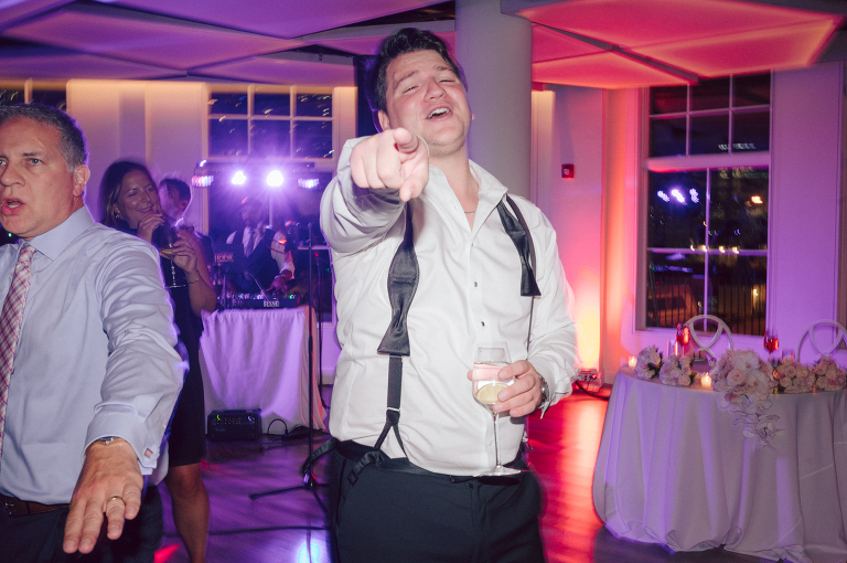 On September 1, 2023 Renee and Sam got married at Maritime Parc located in the center of Liberty State Park where you can get the best view of NYC skyline. Renee and Sam couldn't have asked for a better day, weather in October it was sunny, warm and gorgeous. Renee got ready at her parents' house in Paramus NJ where Renee intimately got ready for her wedding with her parents, two sisters and best friends. Renee's hair and makeup was done by Anna Posokhina from Bridal Squad. Once Renee was all glammed out by Anna Posokhina with help of her mother and two sisters walked into her Justin Alexander wedding dress. With final spray of Jo Malone perfume Renee walked out of her parents' house with her bridesmaids and stepped into her party bus. At the same time Sam was getting ready at Renee's sister's house in Hawthorne NJ with his family and groomsmen. Then Renee and Sam saw each other for the first time down the aisle at Our Lady of the Visitation in Paramus NJ. As soon as Sam saw Renee standing by the entrance of the church started crying. With plenty time for photo we arrived at Liberty State Park where Renee only wanted photos with NYC backdrop even it was staring at the bright sun and squinty eyes, i don't blame her because the view is spectacular and who wouldn't want photos with this gorgeous backdrop of NYC. Cocktail hour started and guests started fill the stairs to third floor of Maritime Parc. Renee and Sam's amazing wedding day at Maritime Parc continued with music provided by live band "The Hook Club" where they set the mood for all night of dancing. And we ended the evening with most amazing NYC skyline with Super moon rising above NYC. Renee and Sam's Maritime Park Jersey City NJ wedding photographed and documented by by Karis | Hey Karis | Catskills, Hudson Valley NY elopement and wedding photographer | Brooklyn NY elopement and wedding photographer | Manhattan NY elopement and wedding photographer | Hey Karis is fun documentary wedding and elopement photographer.