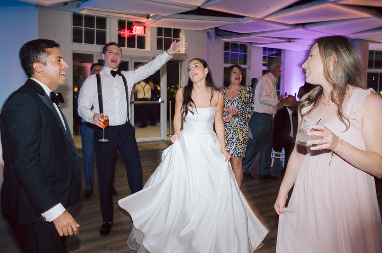 On September 1, 2023 Renee and Sam got married at Maritime Parc located in the center of Liberty State Park where you can get the best view of NYC skyline. Renee and Sam couldn't have asked for a better day, weather in October it was sunny, warm and gorgeous. Renee got ready at her parents' house in Paramus NJ where Renee intimately got ready for her wedding with her parents, two sisters and best friends. Renee's hair and makeup was done by Anna Posokhina from Bridal Squad. Once Renee was all glammed out by Anna Posokhina with help of her mother and two sisters walked into her Justin Alexander wedding dress. With final spray of Jo Malone perfume Renee walked out of her parents' house with her bridesmaids and stepped into her party bus. At the same time Sam was getting ready at Renee's sister's house in Hawthorne NJ with his family and groomsmen. Then Renee and Sam saw each other for the first time down the aisle at Our Lady of the Visitation in Paramus NJ. As soon as Sam saw Renee standing by the entrance of the church started crying. With plenty time for photo we arrived at Liberty State Park where Renee only wanted photos with NYC backdrop even it was staring at the bright sun and squinty eyes, i don't blame her because the view is spectacular and who wouldn't want photos with this gorgeous backdrop of NYC. Cocktail hour started and guests started fill the stairs to third floor of Maritime Parc. Renee and Sam's amazing wedding day at Maritime Parc continued with music provided by live band "The Hook Club" where they set the mood for all night of dancing. And we ended the evening with most amazing NYC skyline with Super moon rising above NYC. Renee and Sam's Maritime Park Jersey City NJ wedding photographed and documented by by Karis | Hey Karis | Catskills, Hudson Valley NY elopement and wedding photographer | Brooklyn NY elopement and wedding photographer | Manhattan NY elopement and wedding photographer | Hey Karis is fun documentary wedding and elopement photographer.