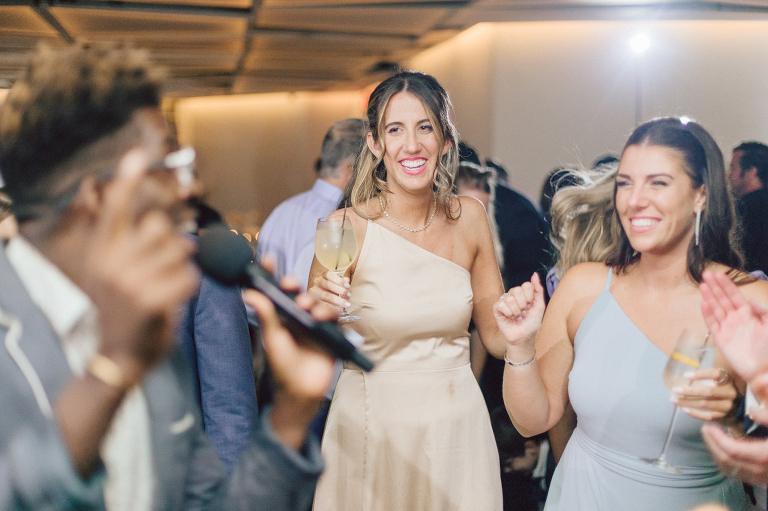 On September 1, 2023 Renee and Sam got married at Maritime Parc located in the center of Liberty State Park where you can get the best view of NYC skyline. Renee and Sam couldn't have asked for a better day, weather in October it was sunny, warm and gorgeous. Renee got ready at her parents' house in Paramus NJ where Renee intimately got ready for her wedding with her parents, two sisters and best friends. Renee's hair and makeup was done by Anna Posokhina from Bridal Squad. Once Renee was all glammed out by Anna Posokhina with help of her mother and two sisters walked into her Justin Alexander wedding dress. With final spray of Jo Malone perfume Renee walked out of her parents' house with her bridesmaids and stepped into her party bus. At the same time Sam was getting ready at Renee's sister's house in Hawthorne NJ with his family and groomsmen. Then Renee and Sam saw each other for the first time down the aisle at Our Lady of the Visitation in Paramus NJ. As soon as Sam saw Renee standing by the entrance of the church started crying. With plenty time for photo we arrived at Liberty State Park where Renee only wanted photos with NYC backdrop even it was staring at the bright sun and squinty eyes, i don't blame her because the view is spectacular and who wouldn't want photos with this gorgeous backdrop of NYC. Cocktail hour started and guests started fill the stairs to third floor of Maritime Parc. Renee and Sam's amazing wedding day at Maritime Parc continued with music provided by live band "The Hook Club" where they set the mood for all night of dancing. And we ended the evening with most amazing NYC skyline with Super moon rising above NYC. Renee and Sam's Maritime Park Jersey City NJ wedding photographed and documented by by Karis | Hey Karis | Catskills, Hudson Valley NY elopement and wedding photographer | Brooklyn NY elopement and wedding photographer | Manhattan NY elopement and wedding photographer | Hey Karis is fun documentary wedding and elopement photographer.
