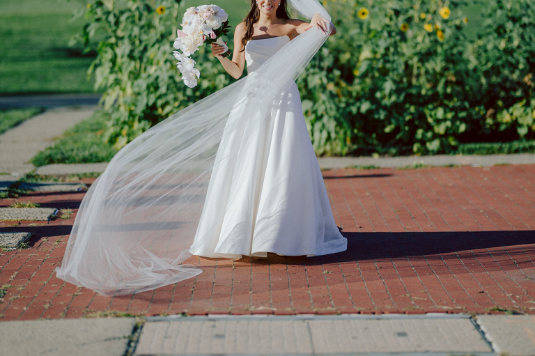 On September 1, 2023 Renee and Sam got married at Maritime Parc located in the center of Liberty State Park where you can get the best view of NYC skyline. Renee and Sam couldn't have asked for a better day, weather in October it was sunny, warm and gorgeous. Renee got ready at her parents' house in Paramus NJ where Renee intimately got ready for her wedding with her parents, two sisters and best friends. Renee's hair and makeup was done by Anna Posokhina from Bridal Squad. Once Renee was all glammed out by Anna Posokhina with help of her mother and two sisters walked into her Justin Alexander wedding dress. With final spray of Jo Malone perfume Renee walked out of her parents' house with her bridesmaids and stepped into her party bus. At the same time Sam was getting ready at Renee's sister's house in Hawthorne NJ with his family and groomsmen. Then Renee and Sam saw each other for the first time down the aisle at Our Lady of the Visitation in Paramus NJ. As soon as Sam saw Renee standing by the entrance of the church started crying. With plenty time for photo we arrived at Liberty State Park where Renee only wanted photos with NYC backdrop even it was staring at the bright sun and squinty eyes, i don't blame her because the view is spectacular and who wouldn't want photos with this gorgeous backdrop of NYC. Cocktail hour started and guests started fill the stairs to third floor of Maritime Parc. Renee and Sam's amazing wedding day at Maritime Parc continued with music provided by live band "The Hook Club" where they set the mood for all night of dancing. And we ended the evening with most amazing NYC skyline with Super moon rising above NYC. Renee and Sam's Maritime Park Jersey City NJ wedding photographed and documented by by Karis | Hey Karis | Catskills, Hudson Valley NY elopement and wedding photographer | Brooklyn NY elopement and wedding photographer | Manhattan NY elopement and wedding photographer | Hey Karis is fun documentary wedding and elopement photographer.