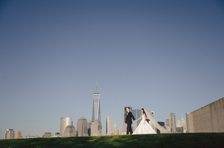 On September 1, 2023 Renee and Sam got married at Maritime Parc located in the center of Liberty State Park where you can get the best view of NYC skyline. Renee and Sam couldn't have asked for a better day, weather in October it was sunny, warm and gorgeous. Renee got ready at her parents' house in Paramus NJ where Renee intimately got ready for her wedding with her parents, two sisters and best friends. Renee's hair and makeup was done by Anna Posokhina from Bridal Squad. Once Renee was all glammed out by Anna Posokhina with help of her mother and two sisters walked into her Justin Alexander wedding dress. With final spray of Jo Malone perfume Renee walked out of her parents' house with her bridesmaids and stepped into her party bus. At the same time Sam was getting ready at Renee's sister's house in Hawthorne NJ with his family and groomsmen. Then Renee and Sam saw each other for the first time down the aisle at Our Lady of the Visitation in Paramus NJ. As soon as Sam saw Renee standing by the entrance of the church started crying. With plenty time for photo we arrived at Liberty State Park where Renee only wanted photos with NYC backdrop even it was staring at the bright sun and squinty eyes, i don't blame her because the view is spectacular and who wouldn't want photos with this gorgeous backdrop of NYC. Cocktail hour started and guests started fill the stairs to third floor of Maritime Parc. Renee and Sam's amazing wedding day at Maritime Parc continued with music provided by live band "The Hook Club" where they set the mood for all night of dancing. And we ended the evening with most amazing NYC skyline with Super moon rising above NYC. Renee and Sam's Maritime Park Jersey City NJ wedding photographed and documented by by Karis | Hey Karis | Catskills, Hudson Valley NY elopement and wedding photographer | Brooklyn NY elopement and wedding photographer | Manhattan NY elopement and wedding photographer | Hey Karis is fun documentary wedding and elopement photographer.
