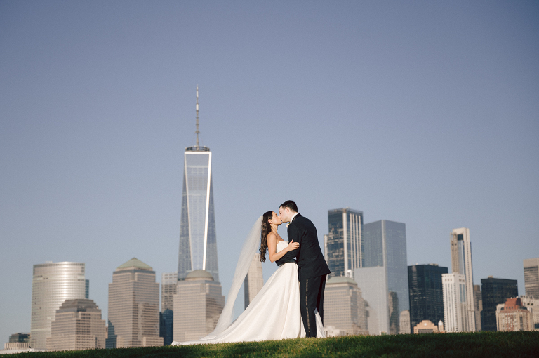 On September 1, 2023 Renee and Sam got married at Maritime Parc located in the center of Liberty State Park where you can get the best view of NYC skyline. Renee and Sam couldn't have asked for a better day, weather in October it was sunny, warm and gorgeous. Renee got ready at her parents' house in Paramus NJ where Renee intimately got ready for her wedding with her parents, two sisters and best friends. Renee's hair and makeup was done by Anna Posokhina from Bridal Squad. Once Renee was all glammed out by Anna Posokhina with help of her mother and two sisters walked into her Justin Alexander wedding dress. With final spray of Jo Malone perfume Renee walked out of her parents' house with her bridesmaids and stepped into her party bus. At the same time Sam was getting ready at Renee's sister's house in Hawthorne NJ with his family and groomsmen. Then Renee and Sam saw each other for the first time down the aisle at Our Lady of the Visitation in Paramus NJ. As soon as Sam saw Renee standing by the entrance of the church started crying. With plenty time for photo we arrived at Liberty State Park where Renee only wanted photos with NYC backdrop even it was staring at the bright sun and squinty eyes, i don't blame her because the view is spectacular and who wouldn't want photos with this gorgeous backdrop of NYC. Cocktail hour started and guests started fill the stairs to third floor of Maritime Parc. Renee and Sam's amazing wedding day at Maritime Parc continued with music provided by live band "The Hook Club" where they set the mood for all night of dancing. And we ended the evening with most amazing NYC skyline with Super moon rising above NYC. Renee and Sam's Maritime Park Jersey City NJ wedding photographed and documented by by Karis | Hey Karis | Catskills, Hudson Valley NY elopement and wedding photographer | Brooklyn NY elopement and wedding photographer | Manhattan NY elopement and wedding photographer | Hey Karis is fun documentary wedding and elopement photographer.
