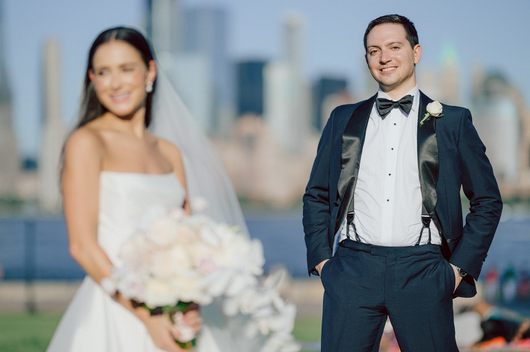 On September 1, 2023 Renee and Sam got married at Maritime Parc located in the center of Liberty State Park where you can get the best view of NYC skyline. Renee and Sam couldn't have asked for a better day, weather in October it was sunny, warm and gorgeous. Renee got ready at her parents' house in Paramus NJ where Renee intimately got ready for her wedding with her parents, two sisters and best friends. Renee's hair and makeup was done by Anna Posokhina from Bridal Squad. Once Renee was all glammed out by Anna Posokhina with help of her mother and two sisters walked into her Justin Alexander wedding dress. With final spray of Jo Malone perfume Renee walked out of her parents' house with her bridesmaids and stepped into her party bus. At the same time Sam was getting ready at Renee's sister's house in Hawthorne NJ with his family and groomsmen. Then Renee and Sam saw each other for the first time down the aisle at Our Lady of the Visitation in Paramus NJ. As soon as Sam saw Renee standing by the entrance of the church started crying. With plenty time for photo we arrived at Liberty State Park where Renee only wanted photos with NYC backdrop even it was staring at the bright sun and squinty eyes, i don't blame her because the view is spectacular and who wouldn't want photos with this gorgeous backdrop of NYC. Cocktail hour started and guests started fill the stairs to third floor of Maritime Parc. Renee and Sam's amazing wedding day at Maritime Parc continued with music provided by live band "The Hook Club" where they set the mood for all night of dancing. And we ended the evening with most amazing NYC skyline with Super moon rising above NYC. Renee and Sam's Maritime Park Jersey City NJ wedding photographed and documented by by Karis | Hey Karis | Catskills, Hudson Valley NY elopement and wedding photographer | Brooklyn NY elopement and wedding photographer | Manhattan NY elopement and wedding photographer | Hey Karis is fun documentary wedding and elopement photographer.
