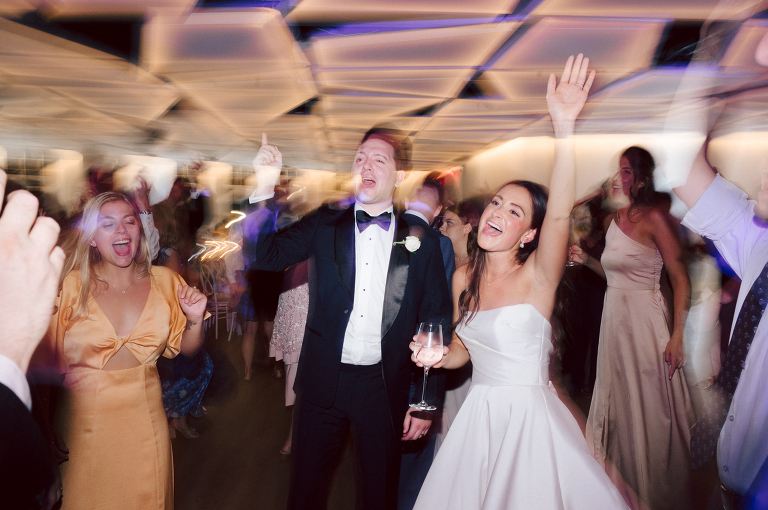 On September 1, 2023 Renee and Sam got married at Maritime Parc located in the center of Liberty State Park where you can get the best view of NYC skyline. Renee and Sam couldn't have asked for a better day, weather in October it was sunny, warm and gorgeous. Renee got ready at her parents' house in Paramus NJ where Renee intimately got ready for her wedding with her parents, two sisters and best friends. Renee's hair and makeup was done by Anna Posokhina from Bridal Squad. Once Renee was all glammed out by Anna Posokhina with help of her mother and two sisters walked into her Justin Alexander wedding dress. With final spray of Jo Malone perfume Renee walked out of her parents' house with her bridesmaids and stepped into her party bus. At the same time Sam was getting ready at Renee's sister's house in Hawthorne NJ with his family and groomsmen. Then Renee and Sam saw each other for the first time down the aisle at Our Lady of the Visitation in Paramus NJ. As soon as Sam saw Renee standing by the entrance of the church started crying. With plenty time for photo we arrived at Liberty State Park where Renee only wanted photos with NYC backdrop even it was staring at the bright sun and squinty eyes, i don't blame her because the view is spectacular and who wouldn't want photos with this gorgeous backdrop of NYC. Cocktail hour started and guests started fill the stairs to third floor of Maritime Parc. Renee and Sam's amazing wedding day at Maritime Parc continued with music provided by live band "The Hook Club" where they set the mood for all night of dancing. And we ended the evening with most amazing NYC skyline with Super moon rising above NYC. Renee and Sam's Maritime Park Jersey City NJ wedding photographed and documented by by Karis | Hey Karis | Catskills, Hudson Valley NY elopement and wedding photographer | Brooklyn NY elopement and wedding photographer | Manhattan NY elopement and wedding photographer | Hey Karis is fun documentary wedding and elopement photographer.
