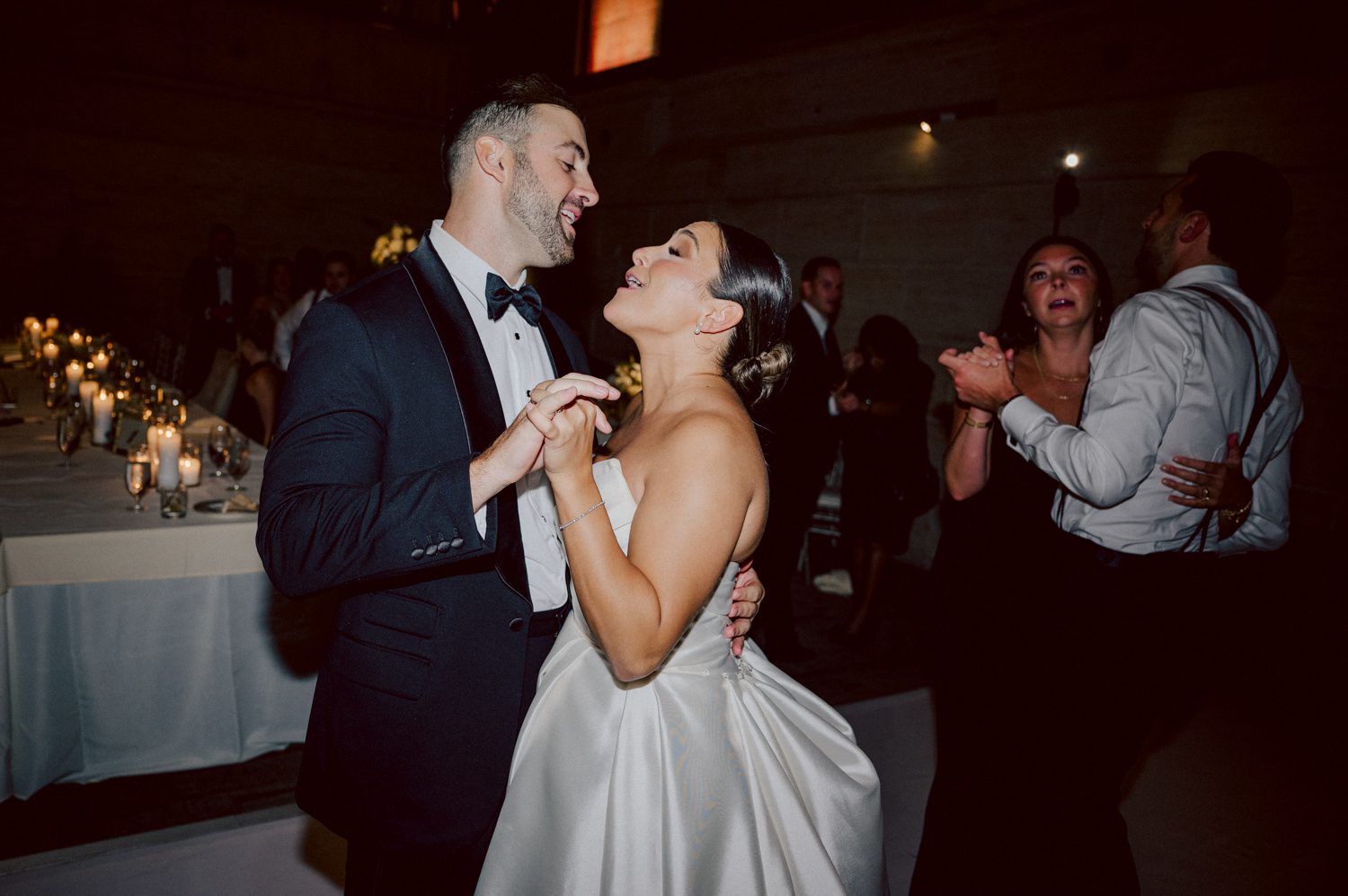 Bianca and Mike's The Union Trust Philadelphia wedding. I met Bianca and Mike at Julie and Thomas's wedding in 2021, Bianca was Julie's bridesmaid and best friend. Bianca and Mike new to book me for their wedding so as soon as they found their dream wedding venue The Union Trust in Philadelphia they emailed me. Honestly these previous couple's referrals are the best because they've already seen me work, familiar with my work and they are my true fans. Bianca got ready onsite at The Union Trust's bridal suit where the lighting was bit wonky with no natural light but hey I make it work! While Bianca was busy getting ready Mike and his buddies were over at Renaissance Hotel Philadelphia. Bianca and Mike also opted out of First Look, Bianca walking down the aisle at St. Augustine’s Philadelphia was when the couple saw each other for the first time and of course their eyes got watery. Bianca and Mike rang the wedding bell at St. Augustine’s Philadelphia and screamed with their arms raised as they exited St. Augustine as husband and wife. It was 4 in the afternoon, everyone loaded on the party bus we drove straight to historic Merchant Exchange Building Philadelphia for photos. The light, the weather was perfect, and surrounded by great people we wrapped up all our formal wedding portraits and now only word PARTY was on everyone's mind including the newly wed Bianca and Mike. Back at The Union Trust Ballroom, florists were busy decorating and entertainment crew was setting up. Together they turned this gorgeous Union Trust Ballroom, into chick and modern vibe. Bianca and Mike entered the ballroom and it was ON for the rest of the evening with party people filling the dance floor at The Union Trust, happily celebrating the union of their favorite people Bianca and Mike. Bianca and Mike's The Union Trust Philadelphia wedding photographed and documented by by Karis | Hey Karis | Catskills, Hudson Valley NY elopement and wedding photographer | Brooklyn NY elopement and wedding photographer | Manhattan NY elopement and wedding photographer | Hey Karis is fun documentary wedding and elopement photographer.