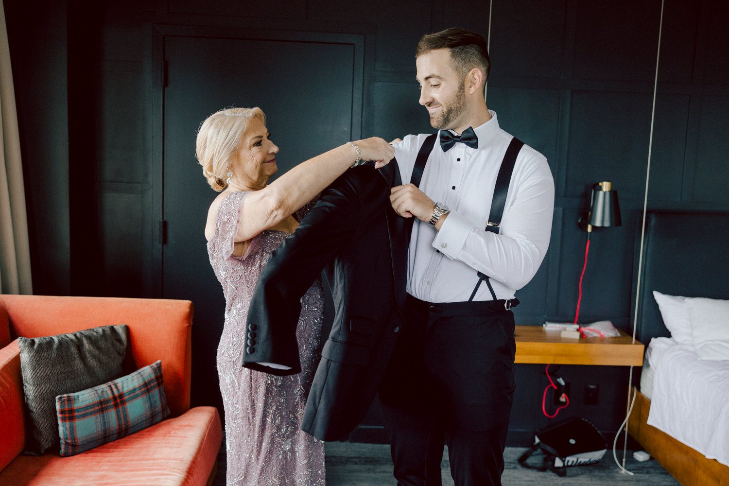 Bianca and Mike's The Union Trust Philadelphia wedding. I met Bianca and Mike at Julie and Thomas's wedding in 2021, Bianca was Julie's bridesmaid and best friend. Bianca and Mike new to book me for their wedding so as soon as they found their dream wedding venue The Union Trust in Philadelphia they emailed me. Honestly these previous couple's referrals are the best because they've already seen me work, familiar with my work and they are my true fans. Bianca got ready onsite at The Union Trust's bridal suit where the lighting was bit wonky with no natural light but hey I make it work! While Bianca was busy getting ready Mike and his buddies were over at Renaissance Hotel Philadelphia. Bianca and Mike also opted out of First Look, Bianca walking down the aisle at St. Augustine’s Philadelphia was when the couple saw each other for the first time and of course their eyes got watery. Bianca and Mike rang the wedding bell at St. Augustine’s Philadelphia and screamed with their arms raised as they exited St. Augustine as husband and wife. It was 4 in the afternoon, everyone loaded on the party bus we drove straight to historic Merchant Exchange Building Philadelphia for photos. The light, the weather was perfect, and surrounded by great people we wrapped up all our formal wedding portraits and now only word PARTY was on everyone's mind including the newly wed Bianca and Mike. Back at The Union Trust Ballroom, florists were busy decorating and entertainment crew was setting up. Together they turned this gorgeous Union Trust Ballroom, into chick and modern vibe. Bianca and Mike entered the ballroom and it was ON for the rest of the evening with party people filling the dance floor at The Union Trust, happily celebrating the union of their favorite people Bianca and Mike. Bianca and Mike's The Union Trust Philadelphia wedding photographed and documented by by Karis | Hey Karis | Catskills, Hudson Valley NY elopement and wedding photographer | Brooklyn NY elopement and wedding photographer | Manhattan NY elopement and wedding photographer | Hey Karis is fun documentary wedding and elopement photographer.