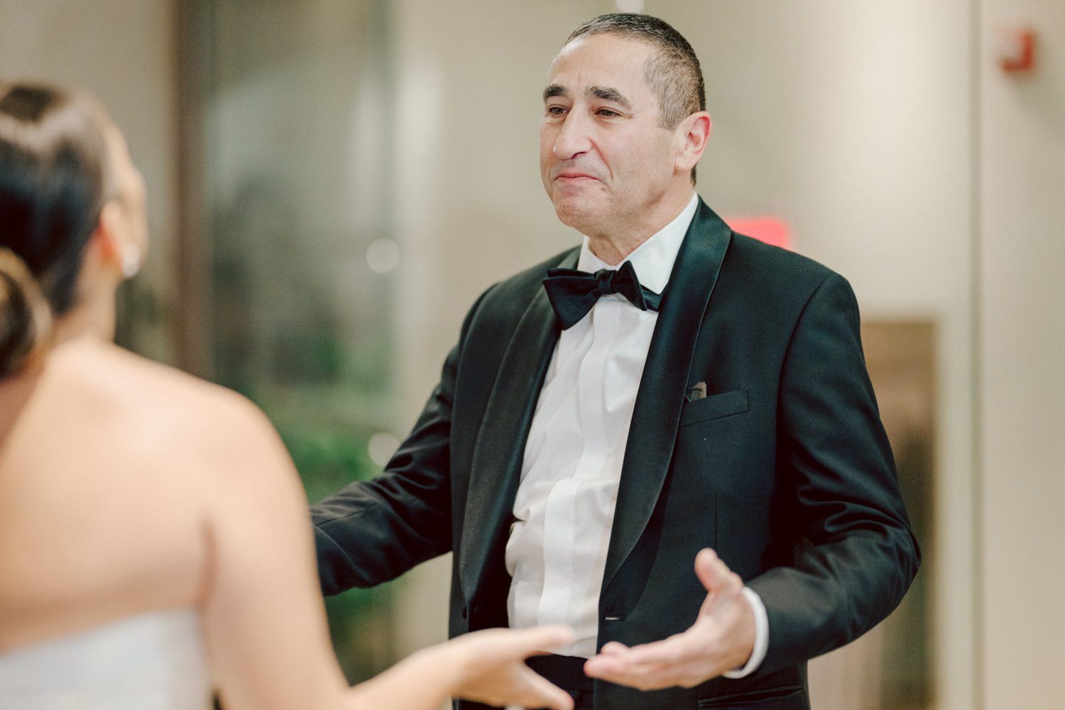 Bianca and Mike's The Union Trust Philadelphia wedding. I met Bianca and Mike at Julie and Thomas's wedding in 2021, Bianca was Julie's bridesmaid and best friend. Bianca and Mike new to book me for their wedding so as soon as they found their dream wedding venue The Union Trust in Philadelphia they emailed me. Honestly these previous couple's referrals are the best because they've already seen me work, familiar with my work and they are my true fans. Bianca got ready onsite at The Union Trust's bridal suit where the lighting was bit wonky with no natural light but hey I make it work! While Bianca was busy getting ready Mike and his buddies were over at Renaissance Hotel Philadelphia. Bianca and Mike also opted out of First Look, Bianca walking down the aisle at St. Augustine’s Philadelphia was when the couple saw each other for the first time and of course their eyes got watery. Bianca and Mike rang the wedding bell at St. Augustine’s Philadelphia and screamed with their arms raised as they exited St. Augustine as husband and wife. It was 4 in the afternoon, everyone loaded on the party bus we drove straight to historic Merchant Exchange Building Philadelphia for photos. The light, the weather was perfect, and surrounded by great people we wrapped up all our formal wedding portraits and now only word PARTY was on everyone's mind including the newly wed Bianca and Mike. Back at The Union Trust Ballroom, florists were busy decorating and entertainment crew was setting up. Together they turned this gorgeous Union Trust Ballroom, into chick and modern vibe. Bianca and Mike entered the ballroom and it was ON for the rest of the evening with party people filling the dance floor at The Union Trust, happily celebrating the union of their favorite people Bianca and Mike. Bianca and Mike's The Union Trust Philadelphia wedding photographed and documented by by Karis | Hey Karis | Catskills, Hudson Valley NY elopement and wedding photographer | Brooklyn NY elopement and wedding photographer | Manhattan NY elopement and wedding photographer | Hey Karis is fun documentary wedding and elopement photographer.