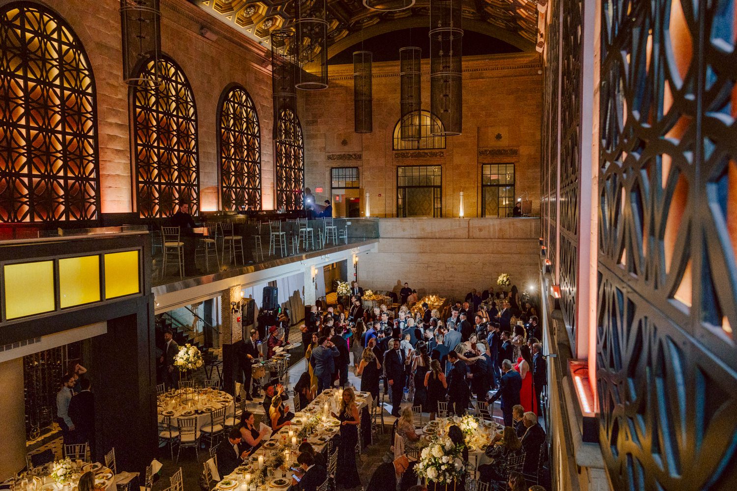 Bianca and Mike's The Union Trust Philadelphia wedding. I met Bianca and Mike at Julie and Thomas's wedding in 2021, Bianca was Julie's bridesmaid and best friend. Bianca and Mike new to book me for their wedding so as soon as they found their dream wedding venue The Union Trust in Philadelphia they emailed me. Honestly these previous couple's referrals are the best because they've already seen me work, familiar with my work and they are my true fans. Bianca got ready onsite at The Union Trust's bridal suit where the lighting was bit wonky with no natural light but hey I make it work! While Bianca was busy getting ready Mike and his buddies were over at Renaissance Hotel Philadelphia. Bianca and Mike also opted out of First Look, Bianca walking down the aisle at St. Augustine’s Philadelphia was when the couple saw each other for the first time and of course their eyes got watery. Bianca and Mike rang the wedding bell at St. Augustine’s Philadelphia and screamed with their arms raised as they exited St. Augustine as husband and wife. It was 4 in the afternoon, everyone loaded on the party bus we drove straight to historic Merchant Exchange Building Philadelphia for photos. The light, the weather was perfect, and surrounded by great people we wrapped up all our formal wedding portraits and now only word PARTY was on everyone's mind including the newly wed Bianca and Mike. Back at The Union Trust Ballroom, florists were busy decorating and entertainment crew was setting up. Together they turned this gorgeous Union Trust Ballroom, into chick and modern vibe. Bianca and Mike entered the ballroom and it was ON for the rest of the evening with party people filling the dance floor at The Union Trust, happily celebrating the union of their favorite people Bianca and Mike. Bianca and Mike's The Union Trust Philadelphia wedding photographed and documented by by Karis | Hey Karis | Catskills, Hudson Valley NY elopement and wedding photographer | Brooklyn NY elopement and wedding photographer | Manhattan NY elopement and wedding photographer | Hey Karis is fun documentary wedding and elopement photographer.