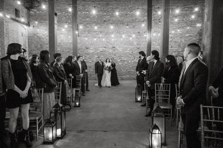 Nestled in the heart of Paterson, New Jersey, The Art Factory stands out as a unique and captivating wedding venue. This expansive warehouse-turned-loft space, with its exposed brick walls and soaring ceilings, serves as a canvas for couples seeking a distinctive backdrop for their special day.

On the memorable evening of October 8, 2023, I had the privilege of capturing the union of Blair and Eric within the enchanting confines of The Art Factory. The choice of this venue perfectly mirrored the essence of Blair and Eric's artistic souls. As creators themselves, the raw, industrial aesthetic and creative atmosphere of The Art Factory resonated deeply with their vision for the celebration.

Blair and Eric, surrounded by a diverse congregation of fellow art enthusiasts, exchanged vows in a ceremony that seamlessly blended tradition with contemporary flair. The venue's unique charm set the stage for a wedding that was as visually stunning as it was heartfelt.

The exposed brick walls and high ceilings provided a rustic yet elegant backdrop, enhancing the vibrancy of every moment captured through my lens. The ambiance was alive with the energy of creativity, a fitting tribute to the artistic journey that Blair and Eric embarked upon together.

As the evening unfolded, it became evident that The Art Factory was not merely a venue; it was an extension of Blair and Eric's artistic expression. The celebration was a testament to their love, surrounded by an eclectic mix of family and friends who shared in their passion for creativity.

Blair and Eric's wedding at The Art Factory in Paterson, NJ, was a masterpiece of love, where every detail reflected the unique canvas of their relationship. It was an honor to document the union of two artists in a space that echoed the beauty of their shared journey.

In the end, The Art Factory not only bore witness to a wedding but also played a vital role in shaping an unforgettable chapter in Blair and Eric's artistic love story. The October evening marked not just a celebration of marriage but a fusion of art, love, and the beauty of creative souls coming together. Blair and Eric's Artsy Warehouse Loft NJ Wedding photographed and documented by by Karis | Hey Karis | Catskills, Hudson Valley NY elopement and wedding photographer | Brooklyn NY elopement and wedding photographer | Manhattan NY elopement and wedding photographer | Hey Karis is fun documentary wedding and elopement photographer.
