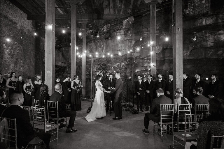 Nestled in the heart of Paterson, New Jersey, The Art Factory stands out as a unique and captivating wedding venue. This expansive warehouse-turned-loft space, with its exposed brick walls and soaring ceilings, serves as a canvas for couples seeking a distinctive backdrop for their special day.

On the memorable evening of October 8, 2023, I had the privilege of capturing the union of Blair and Eric within the enchanting confines of The Art Factory. The choice of this venue perfectly mirrored the essence of Blair and Eric's artistic souls. As creators themselves, the raw, industrial aesthetic and creative atmosphere of The Art Factory resonated deeply with their vision for the celebration.

Blair and Eric, surrounded by a diverse congregation of fellow art enthusiasts, exchanged vows in a ceremony that seamlessly blended tradition with contemporary flair. The venue's unique charm set the stage for a wedding that was as visually stunning as it was heartfelt.

The exposed brick walls and high ceilings provided a rustic yet elegant backdrop, enhancing the vibrancy of every moment captured through my lens. The ambiance was alive with the energy of creativity, a fitting tribute to the artistic journey that Blair and Eric embarked upon together.

As the evening unfolded, it became evident that The Art Factory was not merely a venue; it was an extension of Blair and Eric's artistic expression. The celebration was a testament to their love, surrounded by an eclectic mix of family and friends who shared in their passion for creativity.

Blair and Eric's wedding at The Art Factory in Paterson, NJ, was a masterpiece of love, where every detail reflected the unique canvas of their relationship. It was an honor to document the union of two artists in a space that echoed the beauty of their shared journey.

In the end, The Art Factory not only bore witness to a wedding but also played a vital role in shaping an unforgettable chapter in Blair and Eric's artistic love story. The October evening marked not just a celebration of marriage but a fusion of art, love, and the beauty of creative souls coming together. Blair and Eric's Artsy Warehouse Loft NJ Wedding photographed and documented by by Karis | Hey Karis | Catskills, Hudson Valley NY elopement and wedding photographer | Brooklyn NY elopement and wedding photographer | Manhattan NY elopement and wedding photographer | Hey Karis is fun documentary wedding and elopement photographer.
