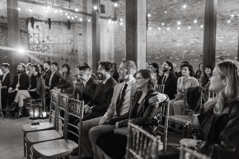 Nestled in the heart of Paterson, New Jersey, The Art Factory stands out as a unique and captivating wedding venue. This expansive warehouse-turned-loft space, with its exposed brick walls and soaring ceilings, serves as a canvas for couples seeking a distinctive backdrop for their special day.

On the memorable evening of October 8, 2023, I had the privilege of capturing the union of Blair and Eric within the enchanting confines of The Art Factory. The choice of this venue perfectly mirrored the essence of Blair and Eric's artistic souls. As creators themselves, the raw, industrial aesthetic and creative atmosphere of The Art Factory resonated deeply with their vision for the celebration.

Blair and Eric, surrounded by a diverse congregation of fellow art enthusiasts, exchanged vows in a ceremony that seamlessly blended tradition with contemporary flair. The venue's unique charm set the stage for a wedding that was as visually stunning as it was heartfelt.

The exposed brick walls and high ceilings provided a rustic yet elegant backdrop, enhancing the vibrancy of every moment captured through my lens. The ambiance was alive with the energy of creativity, a fitting tribute to the artistic journey that Blair and Eric embarked upon together.

As the evening unfolded, it became evident that The Art Factory was not merely a venue; it was an extension of Blair and Eric's artistic expression. The celebration was a testament to their love, surrounded by an eclectic mix of family and friends who shared in their passion for creativity.

Blair and Eric's wedding at The Art Factory in Paterson, NJ, was a masterpiece of love, where every detail reflected the unique canvas of their relationship. It was an honor to document the union of two artists in a space that echoed the beauty of their shared journey.

In the end, The Art Factory not only bore witness to a wedding but also played a vital role in shaping an unforgettable chapter in Blair and Eric's artistic love story. The October evening marked not just a celebration of marriage but a fusion of art, love, and the beauty of creative souls coming together. Blair and Eric's Artsy Warehouse Loft NJ Wedding photographed and documented by by Karis | Hey Karis | Catskills, Hudson Valley NY elopement and wedding photographer | Brooklyn NY elopement and wedding photographer | Manhattan NY elopement and wedding photographer | Hey Karis is fun documentary wedding and elopement photographer.
