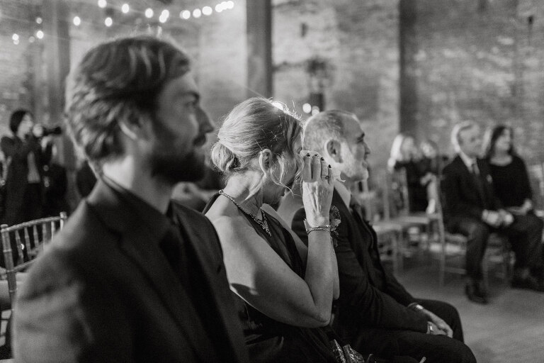 Nestled in the heart of Paterson, New Jersey, The Art Factory stands out as a unique and captivating wedding venue. This expansive warehouse-turned-loft space, with its exposed brick walls and soaring ceilings, serves as a canvas for couples seeking a distinctive backdrop for their special day.

On the memorable evening of October 8, 2023, I had the privilege of capturing the union of Blair and Eric within the enchanting confines of The Art Factory. The choice of this venue perfectly mirrored the essence of Blair and Eric's artistic souls. As creators themselves, the raw, industrial aesthetic and creative atmosphere of The Art Factory resonated deeply with their vision for the celebration.

Blair and Eric, surrounded by a diverse congregation of fellow art enthusiasts, exchanged vows in a ceremony that seamlessly blended tradition with contemporary flair. The venue's unique charm set the stage for a wedding that was as visually stunning as it was heartfelt.

The exposed brick walls and high ceilings provided a rustic yet elegant backdrop, enhancing the vibrancy of every moment captured through my lens. The ambiance was alive with the energy of creativity, a fitting tribute to the artistic journey that Blair and Eric embarked upon together.

As the evening unfolded, it became evident that The Art Factory was not merely a venue; it was an extension of Blair and Eric's artistic expression. The celebration was a testament to their love, surrounded by an eclectic mix of family and friends who shared in their passion for creativity.

Blair and Eric's wedding at The Art Factory in Paterson, NJ, was a masterpiece of love, where every detail reflected the unique canvas of their relationship. It was an honor to document the union of two artists in a space that echoed the beauty of their shared journey.

In the end, The Art Factory not only bore witness to a wedding but also played a vital role in shaping an unforgettable chapter in Blair and Eric's artistic love story. The October evening marked not just a celebration of marriage but a fusion of art, love, and the beauty of creative souls coming together. Blair and Eric's Artsy Warehouse Loft NJ Wedding photographed and documented by by Karis | Hey Karis | Catskills, Hudson Valley NY elopement and wedding photographer | Brooklyn NY elopement and wedding photographer | Manhattan NY elopement and wedding photographer | Hey Karis is fun documentary wedding and elopement photographer.
