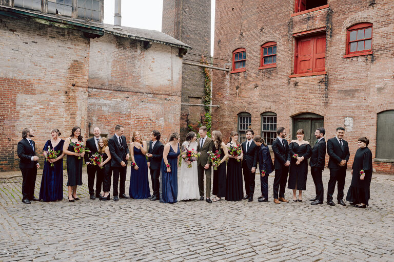 Nestled in the heart of Paterson, New Jersey, The Art Factory stands out as a unique and captivating wedding venue. This expansive warehouse-turned-loft space, with its exposed brick walls and soaring ceilings, serves as a canvas for couples seeking a distinctive backdrop for their special day.

On the memorable evening of October 8, 2023, I had the privilege of capturing the union of Blair and Eric within the enchanting confines of The Art Factory. The choice of this venue perfectly mirrored the essence of Blair and Eric's artistic souls. As creators themselves, the raw, industrial aesthetic and creative atmosphere of The Art Factory resonated deeply with their vision for the celebration.

Blair and Eric, surrounded by a diverse congregation of fellow art enthusiasts, exchanged vows in a ceremony that seamlessly blended tradition with contemporary flair. The venue's unique charm set the stage for a wedding that was as visually stunning as it was heartfelt.

The exposed brick walls and high ceilings provided a rustic yet elegant backdrop, enhancing the vibrancy of every moment captured through my lens. The ambiance was alive with the energy of creativity, a fitting tribute to the artistic journey that Blair and Eric embarked upon together.

As the evening unfolded, it became evident that The Art Factory was not merely a venue; it was an extension of Blair and Eric's artistic expression. The celebration was a testament to their love, surrounded by an eclectic mix of family and friends who shared in their passion for creativity.

Blair and Eric's wedding at The Art Factory in Paterson, NJ, was a masterpiece of love, where every detail reflected the unique canvas of their relationship. It was an honor to document the union of two artists in a space that echoed the beauty of their shared journey.

In the end, The Art Factory not only bore witness to a wedding but also played a vital role in shaping an unforgettable chapter in Blair and Eric's artistic love story. The October evening marked not just a celebration of marriage but a fusion of art, love, and the beauty of creative souls coming together. Blair and Eric's Artsy Warehouse Loft NJ Wedding photographed and documented by by Karis | Hey Karis | Catskills, Hudson Valley NY elopement and wedding photographer | Brooklyn NY elopement and wedding photographer | Manhattan NY elopement and wedding photographer | Hey Karis is fun documentary wedding and elopement photographer.
