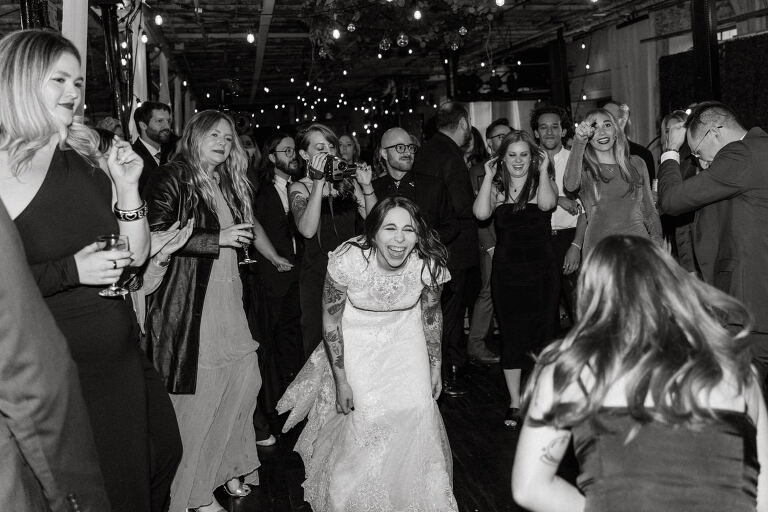 Nestled in the heart of Paterson, New Jersey, The Art Factory stands out as a unique and captivating wedding venue. This expansive warehouse-turned-loft space, with its exposed brick walls and soaring ceilings, serves as a canvas for couples seeking a distinctive backdrop for their special day.

On the memorable evening of October 8, 2023, I had the privilege of capturing the union of Blair and Eric within the enchanting confines of The Art Factory. The choice of this venue perfectly mirrored the essence of Blair and Eric's artistic souls. As creators themselves, the raw, industrial aesthetic and creative atmosphere of The Art Factory resonated deeply with their vision for the celebration.

Blair and Eric, surrounded by a diverse congregation of fellow art enthusiasts, exchanged vows in a ceremony that seamlessly blended tradition with contemporary flair. The venue's unique charm set the stage for a wedding that was as visually stunning as it was heartfelt.

The exposed brick walls and high ceilings provided a rustic yet elegant backdrop, enhancing the vibrancy of every moment captured through my lens. The ambiance was alive with the energy of creativity, a fitting tribute to the artistic journey that Blair and Eric embarked upon together.

As the evening unfolded, it became evident that The Art Factory was not merely a venue; it was an extension of Blair and Eric's artistic expression. The celebration was a testament to their love, surrounded by an eclectic mix of family and friends who shared in their passion for creativity.

Blair and Eric's wedding at The Art Factory in Paterson, NJ, was a masterpiece of love, where every detail reflected the unique canvas of their relationship. It was an honor to document the union of two artists in a space that echoed the beauty of their shared journey.

In the end, The Art Factory not only bore witness to a wedding but also played a vital role in shaping an unforgettable chapter in Blair and Eric's artistic love story. The October evening marked not just a celebration of marriage but a fusion of art, love, and the beauty of creative souls coming together. Blair and Eric's Artsy Warehouse Loft NJ Wedding photographed and documented by by Karis | Hey Karis | Catskills, Hudson Valley NY elopement and wedding photographer | Brooklyn NY elopement and wedding photographer | Manhattan NY elopement and wedding photographer | Hey Karis is fun documentary wedding and elopement photographer.
