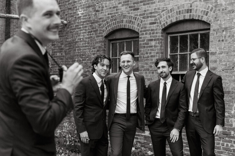 Nestled in the heart of Paterson, New Jersey, The Art Factory stands out as a unique and captivating wedding venue. This expansive warehouse-turned-loft space, with its exposed brick walls and soaring ceilings, serves as a canvas for couples seeking a distinctive backdrop for their special day.

On the memorable evening of October 8, 2023, I had the privilege of capturing the union of Blair and Eric within the enchanting confines of The Art Factory. The choice of this venue perfectly mirrored the essence of Blair and Eric's artistic souls. As creators themselves, the raw, industrial aesthetic and creative atmosphere of The Art Factory resonated deeply with their vision for the celebration.

Blair and Eric, surrounded by a diverse congregation of fellow art enthusiasts, exchanged vows in a ceremony that seamlessly blended tradition with contemporary flair. The venue's unique charm set the stage for a wedding that was as visually stunning as it was heartfelt.

The exposed brick walls and high ceilings provided a rustic yet elegant backdrop, enhancing the vibrancy of every moment captured through my lens. The ambiance was alive with the energy of creativity, a fitting tribute to the artistic journey that Blair and Eric embarked upon together.

As the evening unfolded, it became evident that The Art Factory was not merely a venue; it was an extension of Blair and Eric's artistic expression. The celebration was a testament to their love, surrounded by an eclectic mix of family and friends who shared in their passion for creativity.

Blair and Eric's wedding at The Art Factory in Paterson, NJ, was a masterpiece of love, where every detail reflected the unique canvas of their relationship. It was an honor to document the union of two artists in a space that echoed the beauty of their shared journey.

In the end, The Art Factory not only bore witness to a wedding but also played a vital role in shaping an unforgettable chapter in Blair and Eric's artistic love story. The October evening marked not just a celebration of marriage but a fusion of art, love, and the beauty of creative souls coming together. Blair and Eric's Artsy Warehouse Loft NJ Wedding photographed and documented by by Karis | Hey Karis | Catskills, Hudson Valley NY elopement and wedding photographer | Brooklyn NY elopement and wedding photographer | Manhattan NY elopement and wedding photographer | Hey Karis is fun documentary wedding and elopement photographer.
