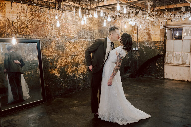 Nestled in the heart of Paterson, New Jersey, The Art Factory stands out as a unique and captivating wedding venue. This expansive warehouse-turned-loft space, with its exposed brick walls and soaring ceilings, serves as a canvas for couples seeking a distinctive backdrop for their special day.

On the memorable evening of October 8, 2023, I had the privilege of capturing the union of Blair and Eric within the enchanting confines of The Art Factory. The choice of this venue perfectly mirrored the essence of Blair and Eric's artistic souls. As creators themselves, the raw, industrial aesthetic and creative atmosphere of The Art Factory resonated deeply with their vision for the celebration.

Blair and Eric, surrounded by a diverse congregation of fellow art enthusiasts, exchanged vows in a ceremony that seamlessly blended tradition with contemporary flair. The venue's unique charm set the stage for a wedding that was as visually stunning as it was heartfelt.

The exposed brick walls and high ceilings provided a rustic yet elegant backdrop, enhancing the vibrancy of every moment captured through my lens. The ambiance was alive with the energy of creativity, a fitting tribute to the artistic journey that Blair and Eric embarked upon together.

As the evening unfolded, it became evident that The Art Factory was not merely a venue; it was an extension of Blair and Eric's artistic expression. The celebration was a testament to their love, surrounded by an eclectic mix of family and friends who shared in their passion for creativity.

Blair and Eric's wedding at The Art Factory in Paterson, NJ, was a masterpiece of love, where every detail reflected the unique canvas of their relationship. It was an honor to document the union of two artists in a space that echoed the beauty of their shared journey.

In the end, The Art Factory not only bore witness to a wedding but also played a vital role in shaping an unforgettable chapter in Blair and Eric's artistic love story. The October evening marked not just a celebration of marriage but a fusion of art, love, and the beauty of creative souls coming together. Blair and Eric's Artsy Warehouse Loft NJ Wedding photographed and documented by by Karis | Hey Karis | Catskills, Hudson Valley NY elopement and wedding photographer | Brooklyn NY elopement and wedding photographer | Manhattan NY elopement and wedding photographer | Hey Karis is fun documentary wedding and elopement photographer.
