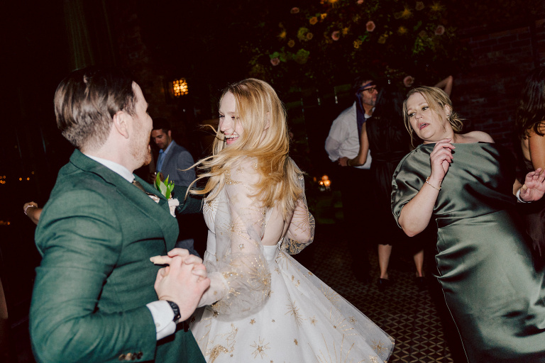 Just days before Halloween, on October 28th, Katie and Craig celebrated their enchanting wedding at the iconic Bowery Hotel in NYC. Having previously photographed an intimate wedding at The Bowery Hotel during the challenges of COVID in 2020, returning to capture the magic of Katie and Craig's celebration was a joyous experience.

The Bowery Hotel, a symbol of the "OLD New York," boasts a rich history intertwined with the stories of its residents. The Bowery Terrace, adorned in classic old-world style, features wood-beamed 13-foot ceilings, salvaged brick walls, Moroccan tiled floors, antique tapestries, an expansive outdoor terrace, and a captivating glazed fireplace. Described by the Huffington Post as a hidden gem with a relaxed and warming atmosphere, The Bowery Terrace served as the perfect backdrop for this magical occasion.

Katie and Craig began their day at The Bowery Hotel in a bridal suite with a terrace spacious enough to host a small wedding. It was on this vast terrace that they shared their first look, exchanging glances, conversations, and hugs. Their private moment culminated in the tender reading of their vows and letters to each other, setting the tone for a day filled with intimacy and love.

Following the intimate vow exchange, we ventured to Bond Street, where a magical bright yellow Ginkgo Tree awaited. The grounds beneath were adorned in a sea of yellow, a sight that perfectly aligned with Katie and Craig's shared love for nature and stars. The decision was unanimous, and we headed for the captivating Yellow Ginkgo Tree in the heart of Manhattan. With Bond Street serving as our backdrop, we captured stunning photos that reflected the essence of this unique couple.

Returning to The Bowery Hotel, families awaited their formal portraits with Katie and Craig. The Bowery Terrace came alive with wedding guests, artists, musicians, and beautiful New Yorkers, all eagerly anticipating the ceremony. As Katie walked down the aisle escorted by her parents, Craig's eyes welled with tears, encapsulating the emotional beauty of the moment.

The wedding ceremony, sweet and humorous, was officiated by their friend Michael Williams. Following the heartfelt exchange of vows, guests spilled out onto the outdoor terrace for a delightful cocktail hour. Meanwhile, the staff at The Bowery Hotel, alongside Planner Ani Wolff and her team, worked their magic, transforming the room into a spooky yet super chic version of "Harry Potter's Hogwarts Great Hall."

The remainder of Katie and Craig's wedding unfolded just as expected—fabulous and magical. The Bowery Hotel provided the perfect canvas for their love story, creating a celebration that will be cherished for years to come.
Katie and Craig's The Bowery Hotel, The Bowery Terrace wedding documented by by Karis | Hey Karis | Catskills, Hudson Valley NY elopement and wedding photographer | Brooklyn NY elopement and wedding photographer | Manhattan NY elopement and wedding photographer | Hey Karis is fun documentary wedding and elopement photographer.