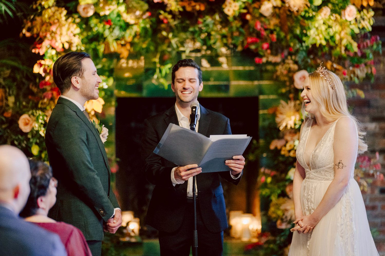 Just days before Halloween, on October 28th, Katie and Craig celebrated their enchanting wedding at the iconic Bowery Hotel in NYC. Having previously photographed an intimate wedding at The Bowery Hotel during the challenges of COVID in 2020, returning to capture the magic of Katie and Craig's celebration was a joyous experience. The Bowery Hotel, a symbol of the "OLD New York," boasts a rich history intertwined with the stories of its residents. The Bowery Terrace, adorned in classic old-world style, features wood-beamed 13-foot ceilings, salvaged brick walls, Moroccan tiled floors, antique tapestries, an expansive outdoor terrace, and a captivating glazed fireplace. Described by the Huffington Post as a hidden gem with a relaxed and warming atmosphere, The Bowery Terrace served as the perfect backdrop for this magical occasion. Katie and Craig began their day at The Bowery Hotel in a bridal suite with a terrace spacious enough to host a small wedding. It was on this vast terrace that they shared their first look, exchanging glances, conversations, and hugs. Their private moment culminated in the tender reading of their vows and letters to each other, setting the tone for a day filled with intimacy and love. Following the intimate vow exchange, we ventured to Bond Street, where a magical bright yellow Ginkgo Tree awaited. The grounds beneath were adorned in a sea of yellow, a sight that perfectly aligned with Katie and Craig's shared love for nature and stars. The decision was unanimous, and we headed for the captivating Yellow Ginkgo Tree in the heart of Manhattan. With Bond Street serving as our backdrop, we captured stunning photos that reflected the essence of this unique couple. Returning to The Bowery Hotel, families awaited their formal portraits with Katie and Craig. The Bowery Terrace came alive with wedding guests, artists, musicians, and beautiful New Yorkers, all eagerly anticipating the ceremony. As Katie walked down the aisle escorted by her parents, Craig's eyes welled with tears, encapsulating the emotional beauty of the moment. The wedding ceremony, sweet and humorous, was officiated by their friend Michael Williams. Following the heartfelt exchange of vows, guests spilled out onto the outdoor terrace for a delightful cocktail hour. Meanwhile, the staff at The Bowery Hotel, alongside Planner Ani Wolff and her team, worked their magic, transforming the room into a spooky yet super chic version of "Harry Potter's Hogwarts Great Hall." The remainder of Katie and Craig's wedding unfolded just as expected—fabulous and magical. The Bowery Hotel provided the perfect canvas for their love story, creating a celebration that will be cherished for years to come. Katie and Craig's The Bowery Hotel, The Bowery Terrace wedding documented by by Karis | Hey Karis | Destination Wedding Photographer | Manhattan, Catskills, Hudson Valley, Brooklyn and NJ | Destination Elopement, Destination Wedding Photographer | Hey Karis is fun documentary wedding and elopement photographer based in NY, NJ.