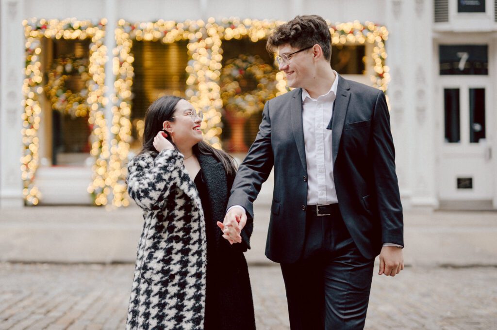 The city streets were refreshingly empty and surreal on an early Saturday morning in chilly December. With all the college students away for winter break, Washington Square Park, surrounded by NYU buildings and dorms, was particularly deserted. Erika and Andrei arrived around 7:30 am, stepping out of their Uber to meet me at the iconic Washington Square Arch. Erika looked stunning in a black velvet romper, while Andrei sported a tuxedo with a "purposely" undone bowtie, creating that effortlessly cool rockstar look for the morning.
Together, we ventured through the chilly, deserted streets of Greenwich Village, making our way to Bond Street and concluding the engagement session in the vibrant East Village by the cube. Along the way, we spontaneously paused at corners, benches, and in front of unique buildings, capturing the essence of their love against the backdrop of the city.
Erika and Andrei's engagement session in Greenwich Village was truly delightful, and I find myself eagerly anticipating their wedding next year at The Box House Hotel in Brooklyn—a venue that has long been on my bucket list. The blend of the picturesque Greenwich Village streets and the upcoming wedding at such a coveted location promises a celebration filled with love and unforgettable moments.
Erika and Andrei's Washington Square Park NYC, Washington Mews NYC, Greenwich Village NYC documented by by Karis | Hey Karis | Destination Wedding Photographer | Manhattan, Catskills, Hudson Valley, Brooklyn and NJ | Destination Elopement, Destination Wedding Photographer | Hey Karis is fun documentary wedding and elopement photographer based in NY, NJ.