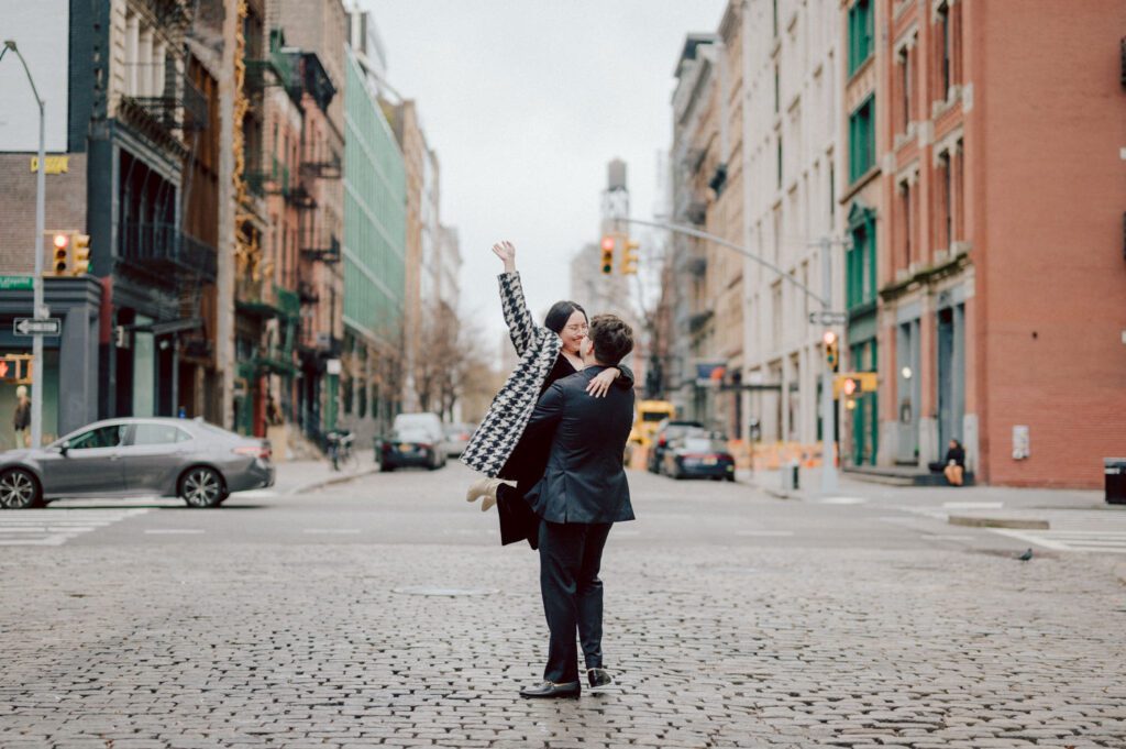 The city streets were refreshingly empty and surreal on an early Saturday morning in chilly December. With all the college students away for winter break, Washington Square Park, surrounded by NYU buildings and dorms, was particularly deserted. Erika and Andrei arrived around 7:30 am, stepping out of their Uber to meet me at the iconic Washington Square Arch. Erika looked stunning in a black velvet romper, while Andrei sported a tuxedo with a "purposely" undone bowtie, creating that effortlessly cool rockstar look for the morning.
Together, we ventured through the chilly, deserted streets of Greenwich Village, making our way to Bond Street and concluding the engagement session in the vibrant East Village by the cube. Along the way, we spontaneously paused at corners, benches, and in front of unique buildings, capturing the essence of their love against the backdrop of the city.
Erika and Andrei's engagement session in Greenwich Village was truly delightful, and I find myself eagerly anticipating their wedding next year at The Box House Hotel in Brooklyn—a venue that has long been on my bucket list. The blend of the picturesque Greenwich Village streets and the upcoming wedding at such a coveted location promises a celebration filled with love and unforgettable moments.
Erika and Andrei's Washington Square Park NYC, Washington Mews NYC, Greenwich Village NYC documented by by Karis | Hey Karis | Destination Wedding Photographer | Manhattan, Catskills, Hudson Valley, Brooklyn and NJ | Destination Elopement, Destination Wedding Photographer | Hey Karis is fun documentary wedding and elopement photographer based in NY, NJ.