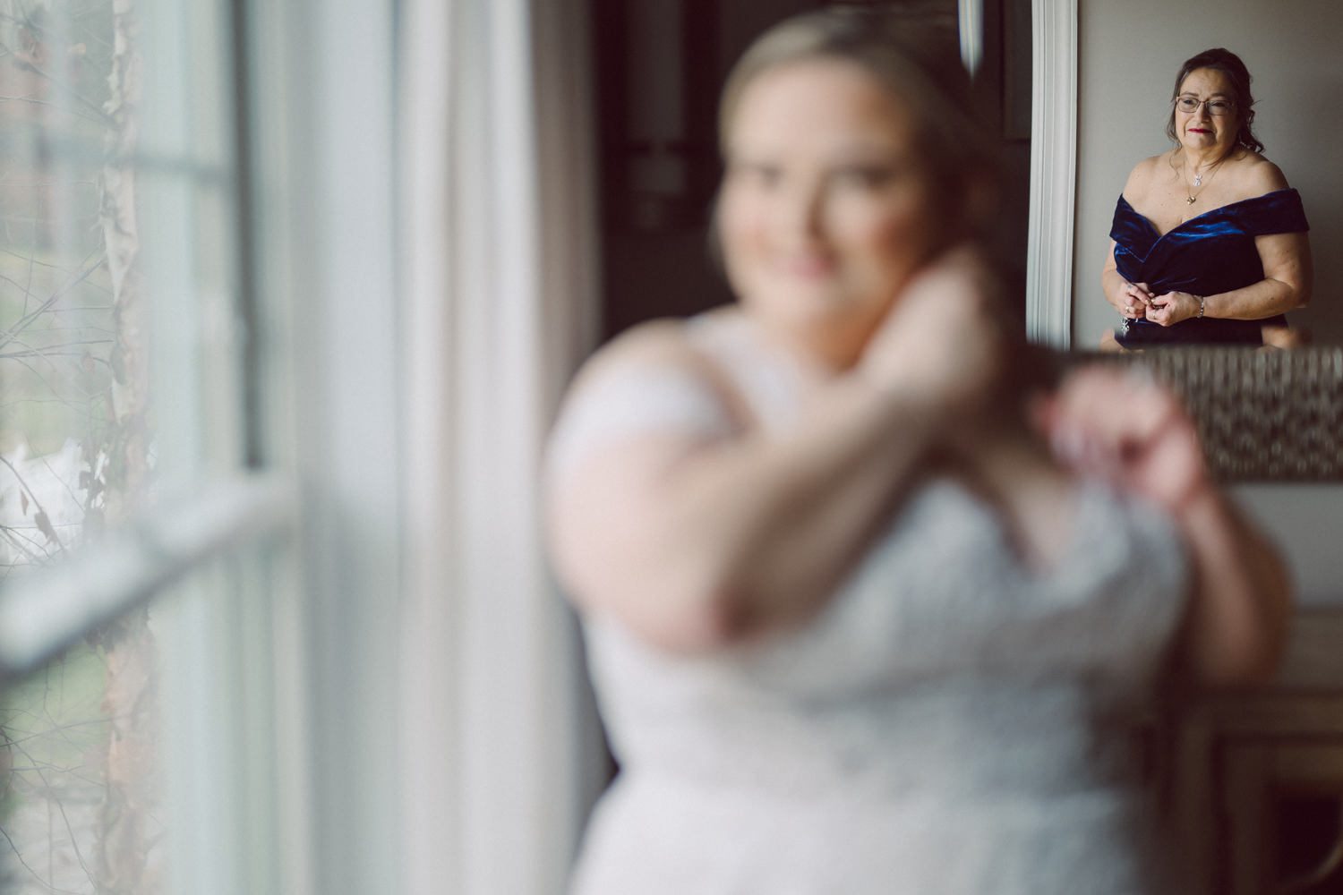 Driving to Bear Brook Valley in Fredon Township, NJ, can feel long, but perhaps it was the anticipation of capturing my last wedding of 2023 that made the journey refreshing and surprisingly brisk. Heather and Ryan, the delightful couple at the center of this celebration, added to the joy of the day. With Kelly from Gifted Events overseeing the wedding planning, I knew it was bound to be a smooth and amazing event.

Despite a bit of overcast weather, I was relieved there was no rain. Recalling a previous visit to Bear Brook Valley, where freezing temperatures and strong winds made outdoor photography challenging, I welcomed the calmness of the day. Dealing with wind is always tricky—veils and hair flying everywhere can hinder outdoor photo sessions. Given the choice, I'll gladly opt for an overcast, tranquil day over a windy one.

Kelly and her team were hard at work setting up the venue, ensuring everything ran seamlessly. Meanwhile, Heather prepared for her big day surrounded by friends and family in her bridal suite. The beauty team put the finishing touches on Heather's hair and makeup, while Egor from Live Picture Studios took charge of videography.

As the morning transitioned into the afternoon, an unexpected twist awaited in Heather and Ryan's first look. Heather's brother-in-law donned a fake wedding gown, providing a humorous and surprising moment that I eagerly captured. With the initial jitters out of the way, Heather descended the stairs to meet Ryan for the first time in her wedding dress, creating a heartwarming moment that left Ryan teary-eyed and Heather shyly smiling.

Following the first look, we explored the picturesque Bear Brook Valley for wedding portraits. From the swing to the hills and between the trees, we captured the essence of their special day. A highlight of the session was the adorable MOKE, Bear Brook Valley's 20th-century Caribbean collectible car reinvented as a 21st-century all-green electric car. With its vibrant yellow color, the MOKE added a playful touch to the photos as we captured moments both inside and outside the charming vehicle.

With the photo session complete, it was time for the main event—the wedding ceremony at Bear Brook Valley's barn, marking what I believe was the venue's very first ceremony of this kind.

The festivities continued into the reception, where Heather and Ryan surprised their guests with a visit from the Devil's Mascot, showcasing their shared enthusiasm as huge Devils fans. The mascot joined the couple and their guests, dancing and mingling for about 30 minutes, leaving a lasting impression on the celebration.

The wedding day concluded with a dazzling sparkler exit, creating a magical and memorable end to Heather and Ryan's celebration at Bear Brook Valley.
 
Heather and Ryan's Bear Brook Valley wedding documented by by Karis | Hey Karis | Destination Wedding Photographer | Manhattan, Catskills, Hudson Valley, Brooklyn and NJ | Destination Elopement, Destination Wedding Photographer | Hey Karis is fun documentary wedding and elopement photographer based in NY, NJ.