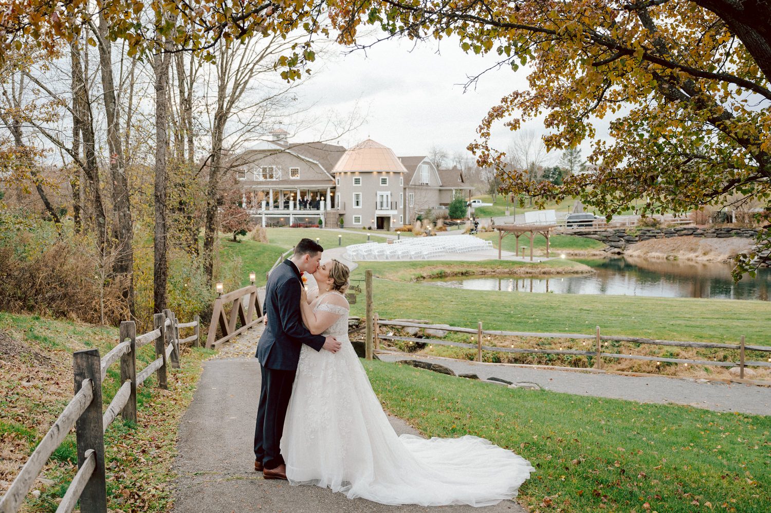 Driving to Bear Brook Valley in Fredon Township, NJ, can feel long, but perhaps it was the anticipation of capturing my last wedding of 2023 that made the journey refreshing and surprisingly brisk. Heather and Ryan, the delightful couple at the center of this celebration, added to the joy of the day. With Kelly from Gifted Events overseeing the wedding planning, I knew it was bound to be a smooth and amazing event.

Despite a bit of overcast weather, I was relieved there was no rain. Recalling a previous visit to Bear Brook Valley, where freezing temperatures and strong winds made outdoor photography challenging, I welcomed the calmness of the day. Dealing with wind is always tricky—veils and hair flying everywhere can hinder outdoor photo sessions. Given the choice, I'll gladly opt for an overcast, tranquil day over a windy one.

Kelly and her team were hard at work setting up the venue, ensuring everything ran seamlessly. Meanwhile, Heather prepared for her big day surrounded by friends and family in her bridal suite. The beauty team put the finishing touches on Heather's hair and makeup, while Egor from Live Picture Studios took charge of videography.

As the morning transitioned into the afternoon, an unexpected twist awaited in Heather and Ryan's first look. Heather's brother-in-law donned a fake wedding gown, providing a humorous and surprising moment that I eagerly captured. With the initial jitters out of the way, Heather descended the stairs to meet Ryan for the first time in her wedding dress, creating a heartwarming moment that left Ryan teary-eyed and Heather shyly smiling.

Following the first look, we explored the picturesque Bear Brook Valley for wedding portraits. From the swing to the hills and between the trees, we captured the essence of their special day. A highlight of the session was the adorable MOKE, Bear Brook Valley's 20th-century Caribbean collectible car reinvented as a 21st-century all-green electric car. With its vibrant yellow color, the MOKE added a playful touch to the photos as we captured moments both inside and outside the charming vehicle.

With the photo session complete, it was time for the main event—the wedding ceremony at Bear Brook Valley's barn, marking what I believe was the venue's very first ceremony of this kind.

The festivities continued into the reception, where Heather and Ryan surprised their guests with a visit from the Devil's Mascot, showcasing their shared enthusiasm as huge Devils fans. The mascot joined the couple and their guests, dancing and mingling for about 30 minutes, leaving a lasting impression on the celebration.

The wedding day concluded with a dazzling sparkler exit, creating a magical and memorable end to Heather and Ryan's celebration at Bear Brook Valley.
 
Heather and Ryan's Bear Brook Valley wedding documented by by Karis | Hey Karis | Destination Wedding Photographer | Manhattan, Catskills, Hudson Valley, Brooklyn and NJ | Destination Elopement, Destination Wedding Photographer | Hey Karis is fun documentary wedding and elopement photographer based in NY, NJ.