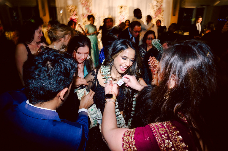 I first crossed paths with Xavier a few years back at Danny and Andy's wedding, where he stood as one of the groomsmen at The Ryland Inn in 2021. When Xavier and Priya's own wedding day approached, I was deeply honored that he remembered me and reached out to discuss capturing their special day.
Meeting Priya and Xavier together during their engagement session in Princeton, NJ was an essential part of my process. It allowed me to delve into their personalities and witness the beautiful chemistry they shared. Engagements sessions, for me, serve as a cornerstone in establishing a genuine connection with my couples before the main event.

Priya and Xavier both started the wedding day at the Hyatt Regency in Jersey City, a venue boasting panoramic views of the Hudson River and the iconic Manhattan skyline. Against this breathtaking backdrop, they readied themselves, shared a heartwarming first look along the Hudson River Waterfront Walkway, then shortly after Priya and Xavier's family and friends joined them for photos.
As Priya watched from a balcony, Xavier's Baraat procession unfolded below, a lively affair marked by music, drums, and joyous celebrations. Following the Baraat wedding guests ascended to the wedding ceremony room at the Hyatt Regency, where a beautifully adorned Mandap awaited their union.

The cocktail hour tantalized guests with an array of delicious Indian cuisine, setting the stage for the grand entrance into the candlelit reception hall. Priya and Xavier stepped in, resplendent in their evening attire, launching into their first dance. This was followed by the traditional Filipino money dance,

Throughout the evening, dance performances, heartfelt parent dances, and touching speeches filled the air with love and laughter. Priya and Xavier's faces radiated with pure joy, reflecting the love that enveloped them on their special day.

Priya and Xavier Hyatt Regency Jersey City NJ wedding documented by by Karis | Hey Karis | Destination Wedding Photographer | Manhattan, Catskills, Hudson Valley, Brooklyn and NJ | Destination Elopement, Destination Wedding Photographer | Hey Karis is fun documentary wedding and elopement photographer based in NY, NJ.