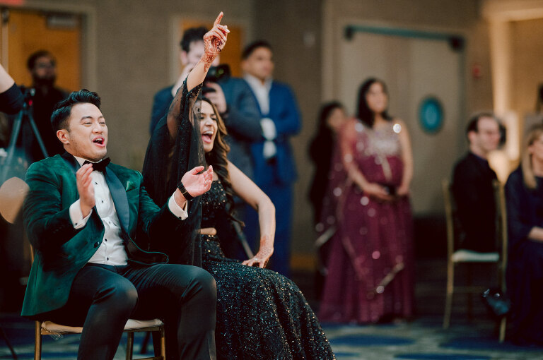 I first crossed paths with Xavier a few years back at Danny and Andy's wedding, where he stood as one of the groomsmen at The Ryland Inn in 2021. When Xavier and Priya's own wedding day approached, I was deeply honored that he remembered me and reached out to discuss capturing their special day.
Meeting Priya and Xavier together during their engagement session in Princeton, NJ was an essential part of my process. It allowed me to delve into their personalities and witness the beautiful chemistry they shared. Engagements sessions, for me, serve as a cornerstone in establishing a genuine connection with my couples before the main event.

Priya and Xavier both started the wedding day at the Hyatt Regency in Jersey City, a venue boasting panoramic views of the Hudson River and the iconic Manhattan skyline. Against this breathtaking backdrop, they readied themselves, shared a heartwarming first look along the Hudson River Waterfront Walkway, then shortly after Priya and Xavier's family and friends joined them for photos.
As Priya watched from a balcony, Xavier's Baraat procession unfolded below, a lively affair marked by music, drums, and joyous celebrations. Following the Baraat wedding guests ascended to the wedding ceremony room at the Hyatt Regency, where a beautifully adorned Mandap awaited their union.

The cocktail hour tantalized guests with an array of delicious Indian cuisine, setting the stage for the grand entrance into the candlelit reception hall. Priya and Xavier stepped in, resplendent in their evening attire, launching into their first dance. This was followed by the traditional Filipino money dance,

Throughout the evening, dance performances, heartfelt parent dances, and touching speeches filled the air with love and laughter. Priya and Xavier's faces radiated with pure joy, reflecting the love that enveloped them on their special day.

Priya and Xavier Hyatt Regency Jersey City NJ wedding documented by by Karis | Hey Karis | Destination Wedding Photographer | Manhattan, Catskills, Hudson Valley, Brooklyn and NJ | Destination Elopement, Destination Wedding Photographer | Hey Karis is fun documentary wedding and elopement photographer based in NY, NJ.
