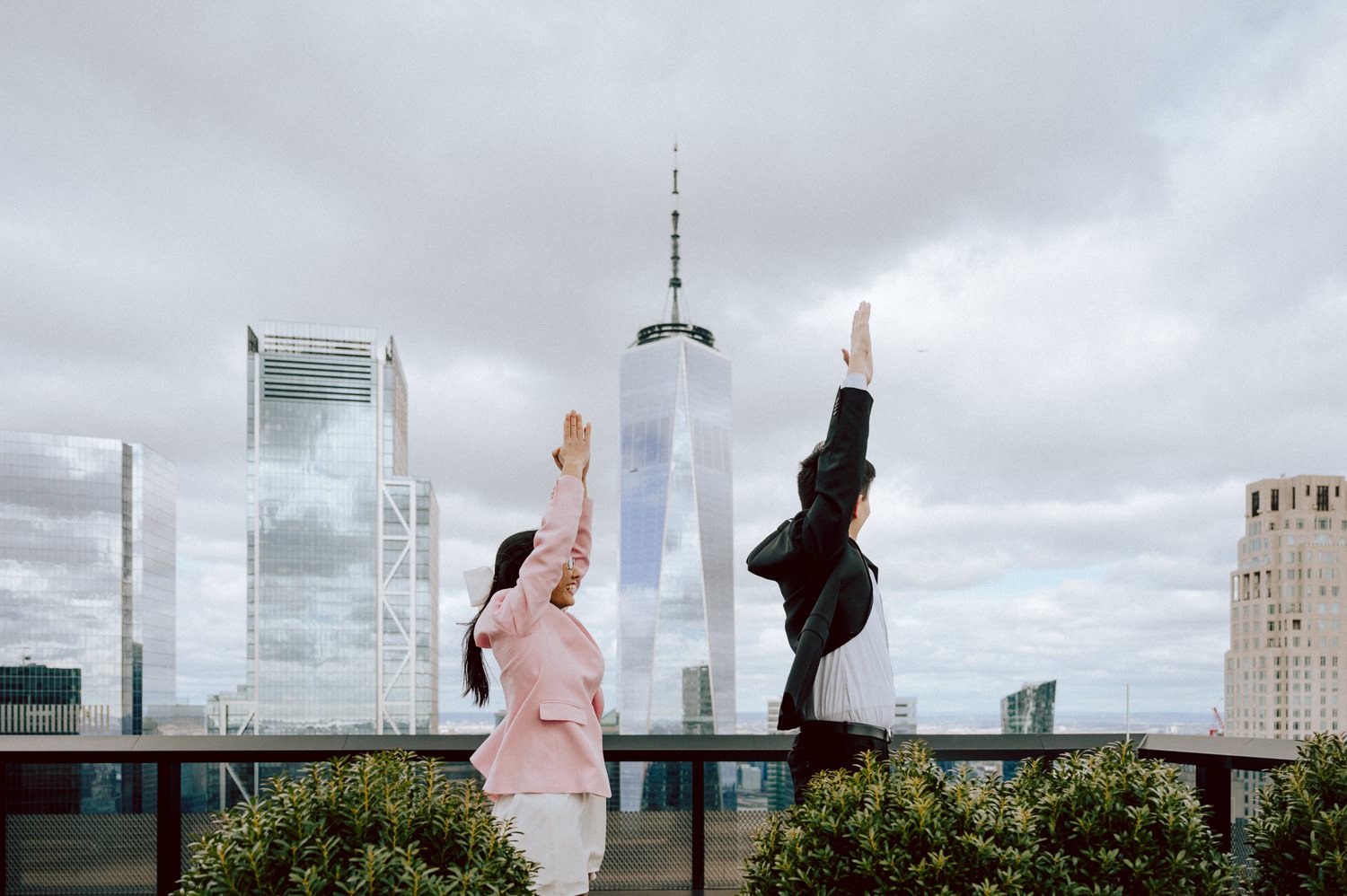 Alicia and Kevin made the bold decision to elope in the heart of the Big Apple before bidding adieu to city life and embracing suburban tranquility in New Jersey. Their choice resonates; after all, there's something undeniably magnetic about tying the knot in NYC that sets it apart from anywhere else in the world. Less than two weeks before their planned elopement at NYC City Hall, Alicia and Kevin reached out to me. I promptly scheduled a call to delve into the details, eager to understand their vision and expectations for their special day. It was essential for me to grasp their vibe and personalities; forging this connection and building relationship before the big day is super important to me. On April 5, I rendezvoused with Alicia and Kevin outside The Office of the City Clerk - Marriage Bureau. Despite hoping for a warm, sunny day, the brisk April air lingered, accompanied by a chilly breeze. Accompanied by a friend who served as their witness, we walked into the building. My camera was ready from outside documenting Alicia and Kevin, as I wanted to tell their story from beginning to end. Inside, we navigated the bureaucratic procedures, clicking away at Alicia and Kevin as they pleasantly waited for their number to be called. With paperwork signed and formalities concluded, Alicia and Kevin became husband and wife in the blink of an eye. We stayed a while longer inside the marriage bureau took the opportunity to capture some timeless moments posing on the iconic green sofa and NYC City Hall wall mural. Then we journeyed outside and wandered the vibrant bustling streets of NYC for some more photos. And what better way to conclude Alicia and Kevin's NYC City Hall elopement than with a quintessential New York slice. Alicia and Kevin NYC City Hall NY Elopement documented by by Karis | Hey Karis | Destination Wedding Photographer | Manhattan, Catskills, Hudson Valley, Brooklyn and NJ | Destination Elopement, Destination Wedding Photographer | Hey Karis is fun documentary wedding and elopement photographer based in NY, NJ.