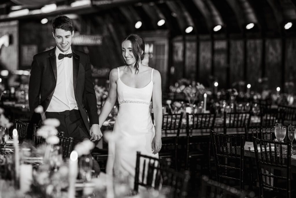 Malia and Aidan, currently residing in DC with their beloved pup Max, envisioned a wedding that reflected their laid-back, natural style. When we first chatted back in February 2023, they emphasized their desire for relaxed, fun, and candid photos that captured genuine moments.
Choosing The Barn at Perona Farms was a perfect fit for Malia and Aidan. Nestled amidst charming rustic surroundings and abundant nature, the venue complemented their preference for an authentic and unposed wedding day experience.
The ceremony took place outdoors on the lush lawn of The Barn at Perona Farms, exactly as they had envisioned – sweet, whimsy, and just the way they wanted it. Guests enjoyed a leisurely cocktail hour accompanied by live music courtesy of the talented Blue Label Band. The air was filled with the sounds of laughter and the clinking of wine glasses as everyone soaked in the joyful atmosphere.
As the evening progressed upstairs at The Barn, the ambiance was transformed by Moonlit Acres' stunning floral arrangements, candles, and elegant drapes. The space slowly filled with guests, reconnecting and sharing stories, delighted to be together again.
Then, the moment everyone had been waiting for: Malia and Aidan entered the room, surrounded by loved ones, and shared their first dance together.
Malia and Aidan's The Barn at Perona Farms NJ wedding documented by by Karis | Hey Karis | Destination Wedding Photographer | Manhattan, Catskills, Hudson Valley, Brooklyn and NJ | Destination Elopement, Destination Wedding Photographer | Hey Karis is fun documentary wedding and elopement photographer based in NY, NJ.