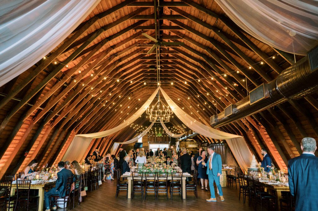 Malia and Aidan, currently residing in DC with their beloved pup Max, envisioned a wedding that reflected their laid-back, natural style. When we first chatted back in February 2023, they emphasized their desire for relaxed, fun, and candid photos that captured genuine moments.
Choosing The Barn at Perona Farms was a perfect fit for Malia and Aidan. Nestled amidst charming rustic surroundings and abundant nature, the venue complemented their preference for an authentic and unposed wedding day experience.
The ceremony took place outdoors on the lush lawn of The Barn at Perona Farms, exactly as they had envisioned – sweet, whimsy, and just the way they wanted it. Guests enjoyed a leisurely cocktail hour accompanied by live music courtesy of the talented Blue Label Band. The air was filled with the sounds of laughter and the clinking of wine glasses as everyone soaked in the joyful atmosphere.
As the evening progressed upstairs at The Barn, the ambiance was transformed by Moonlit Acres' stunning floral arrangements, candles, and elegant drapes. The space slowly filled with guests, reconnecting and sharing stories, delighted to be together again.
Then, the moment everyone had been waiting for: Malia and Aidan entered the room, surrounded by loved ones, and shared their first dance together.
Malia and Aidan's The Barn at Perona Farms NJ wedding documented by by Karis | Hey Karis | Destination Wedding Photographer | Manhattan, Catskills, Hudson Valley, Brooklyn and NJ | Destination Elopement, Destination Wedding Photographer | Hey Karis is fun documentary wedding and elopement photographer based in NY, NJ.