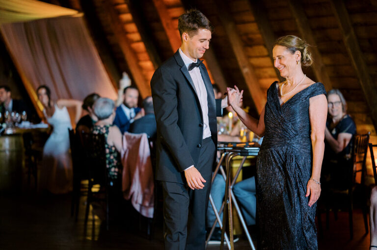 Malia and Aidan, currently residing in DC with their beloved pup Max, envisioned a wedding that reflected their laid-back, natural style. When we first chatted back in February 2023, they emphasized their desire for relaxed, fun, and candid photos that captured genuine moments.
Choosing The Barn at Perona Farms was a perfect fit for Malia and Aidan. Nestled amidst charming rustic surroundings and abundant nature, the venue complemented their preference for an authentic and unposed wedding day experience.
The ceremony took place outdoors on the lush lawn of The Barn at Perona Farms, exactly as they had envisioned – sweet, whimsy, and just the way they wanted it. Guests enjoyed a leisurely cocktail hour accompanied by live music courtesy of the talented Blue Label Band. The air was filled with the sounds of laughter and the clinking of wine glasses as everyone soaked in the joyful atmosphere.
As the evening progressed upstairs at The Barn, the ambiance was transformed by Moonlit Acres' stunning floral arrangements, candles, and elegant drapes. The space slowly filled with guests, reconnecting and sharing stories, delighted to be together again.
Then, the moment everyone had been waiting for: Malia and Aidan entered the room, surrounded by loved ones, and shared their first dance together.
Malia and Aidan's The Barn at Perona Farms NJ wedding documented by by Karis | Hey Karis | Destination Wedding Photographer | Manhattan, Catskills, Hudson Valley, Brooklyn and NJ | Destination Elopement, Destination Wedding Photographer | Hey Karis is fun documentary wedding and elopement photographer based in NY, NJ.
