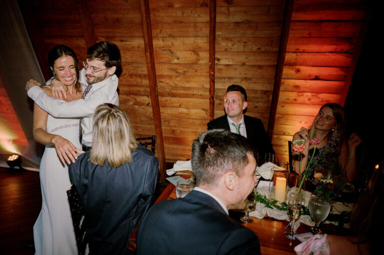 Malia and Aidan, currently residing in DC with their beloved pup Max, envisioned a wedding that reflected their laid-back, natural style. When we first chatted back in February 2023, they emphasized their desire for relaxed, fun, and candid photos that captured genuine moments.
Choosing The Barn at Perona Farms was a perfect fit for Malia and Aidan. Nestled amidst charming rustic surroundings and abundant nature, the venue complemented their preference for an authentic and unposed wedding day experience.
The ceremony took place outdoors on the lush lawn of The Barn at Perona Farms, exactly as they had envisioned – sweet, whimsy, and just the way they wanted it. Guests enjoyed a leisurely cocktail hour accompanied by live music courtesy of the talented Blue Label Band. The air was filled with the sounds of laughter and the clinking of wine glasses as everyone soaked in the joyful atmosphere.
As the evening progressed upstairs at The Barn, the ambiance was transformed by Moonlit Acres' stunning floral arrangements, candles, and elegant drapes. The space slowly filled with guests, reconnecting and sharing stories, delighted to be together again.
Then, the moment everyone had been waiting for: Malia and Aidan entered the room, surrounded by loved ones, and shared their first dance together.
Malia and Aidan's The Barn at Perona Farms NJ wedding documented by by Karis | Hey Karis | Destination Wedding Photographer | Manhattan, Catskills, Hudson Valley, Brooklyn and NJ | Destination Elopement, Destination Wedding Photographer | Hey Karis is fun documentary wedding and elopement photographer based in NY, NJ.