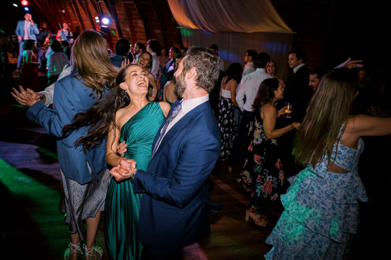 Malia and Aidan, currently residing in DC with their beloved pup Max, envisioned a wedding that reflected their laid-back, natural style. When we first chatted back in February 2023, they emphasized their desire for relaxed, fun, and candid photos that captured genuine moments.
Choosing The Barn at Perona Farms was a perfect fit for Malia and Aidan. Nestled amidst charming rustic surroundings and abundant nature, the venue complemented their preference for an authentic and unposed wedding day experience.
The ceremony took place outdoors on the lush lawn of The Barn at Perona Farms, exactly as they had envisioned – sweet, whimsy, and just the way they wanted it. Guests enjoyed a leisurely cocktail hour accompanied by live music courtesy of the talented Blue Label Band. The air was filled with the sounds of laughter and the clinking of wine glasses as everyone soaked in the joyful atmosphere.
As the evening progressed upstairs at The Barn, the ambiance was transformed by Moonlit Acres' stunning floral arrangements, candles, and elegant drapes. The space slowly filled with guests, reconnecting and sharing stories, delighted to be together again.
Then, the moment everyone had been waiting for: Malia and Aidan entered the room, surrounded by loved ones, and shared their first dance together.
Malia and Aidan's The Barn at Perona Farms NJ wedding documented by by Karis | Hey Karis | Destination Wedding Photographer | Manhattan, Catskills, Hudson Valley, Brooklyn and NJ | Destination Elopement, Destination Wedding Photographer | Hey Karis is fun documentary wedding and elopement photographer based in NY, NJ.