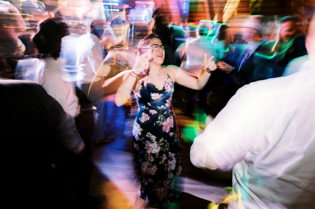 Malia and Aidan, currently residing in DC with their beloved pup Max, envisioned a wedding that reflected their laid-back, natural style. When we first chatted back in February 2023, they emphasized their desire for relaxed, fun, and candid photos that captured genuine moments. Choosing The Barn at Perona Farms was a perfect fit for Malia and Aidan. Nestled amidst charming rustic surroundings and abundant nature, the venue complemented their preference for an authentic and unposed wedding day experience. The ceremony took place outdoors on the lush lawn of The Barn at Perona Farms, exactly as they had envisioned – sweet, whimsy, and just the way they wanted it. Guests enjoyed a leisurely cocktail hour accompanied by live music courtesy of the talented Blue Label Band. The air was filled with the sounds of laughter and the clinking of wine glasses as everyone soaked in the joyful atmosphere. As the evening progressed upstairs at The Barn, the ambiance was transformed by Moonlit Acres' stunning floral arrangements, candles, and elegant drapes. The space slowly filled with guests, reconnecting and sharing stories, delighted to be together again. Then, the moment everyone had been waiting for: Malia and Aidan entered the room, surrounded by loved ones, and shared their first dance together. Malia and Aidan's The Barn at Perona Farms NJ wedding documented by by Karis | Hey Karis | Destination Wedding Photographer | Manhattan, Catskills, Hudson Valley, Brooklyn and NJ | Destination Elopement, Destination Wedding Photographer | Hey Karis is fun documentary wedding and elopement photographer based in NY, NJ.