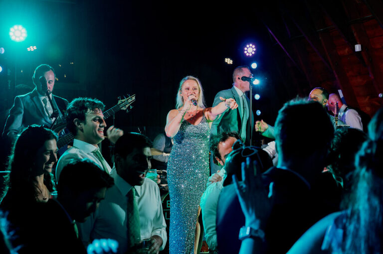 Malia and Aidan, currently residing in DC with their beloved pup Max, envisioned a wedding that reflected their laid-back, natural style. When we first chatted back in February 2023, they emphasized their desire for relaxed, fun, and candid photos that captured genuine moments.
Choosing The Barn at Perona Farms was a perfect fit for Malia and Aidan. Nestled amidst charming rustic surroundings and abundant nature, the venue complemented their preference for an authentic and unposed wedding day experience.
The ceremony took place outdoors on the lush lawn of The Barn at Perona Farms, exactly as they had envisioned – sweet, whimsy, and just the way they wanted it. Guests enjoyed a leisurely cocktail hour accompanied by live music courtesy of the talented Blue Label Band. The air was filled with the sounds of laughter and the clinking of wine glasses as everyone soaked in the joyful atmosphere.
As the evening progressed upstairs at The Barn, the ambiance was transformed by Moonlit Acres' stunning floral arrangements, candles, and elegant drapes. The space slowly filled with guests, reconnecting and sharing stories, delighted to be together again.
Then, the moment everyone had been waiting for: Malia and Aidan entered the room, surrounded by loved ones, and shared their first dance together.
Malia and Aidan's The Barn at Perona Farms NJ wedding documented by by Karis | Hey Karis | Destination Wedding Photographer | Manhattan, Catskills, Hudson Valley, Brooklyn and NJ | Destination Elopement, Destination Wedding Photographer | Hey Karis is fun documentary wedding and elopement photographer based in NY, NJ.